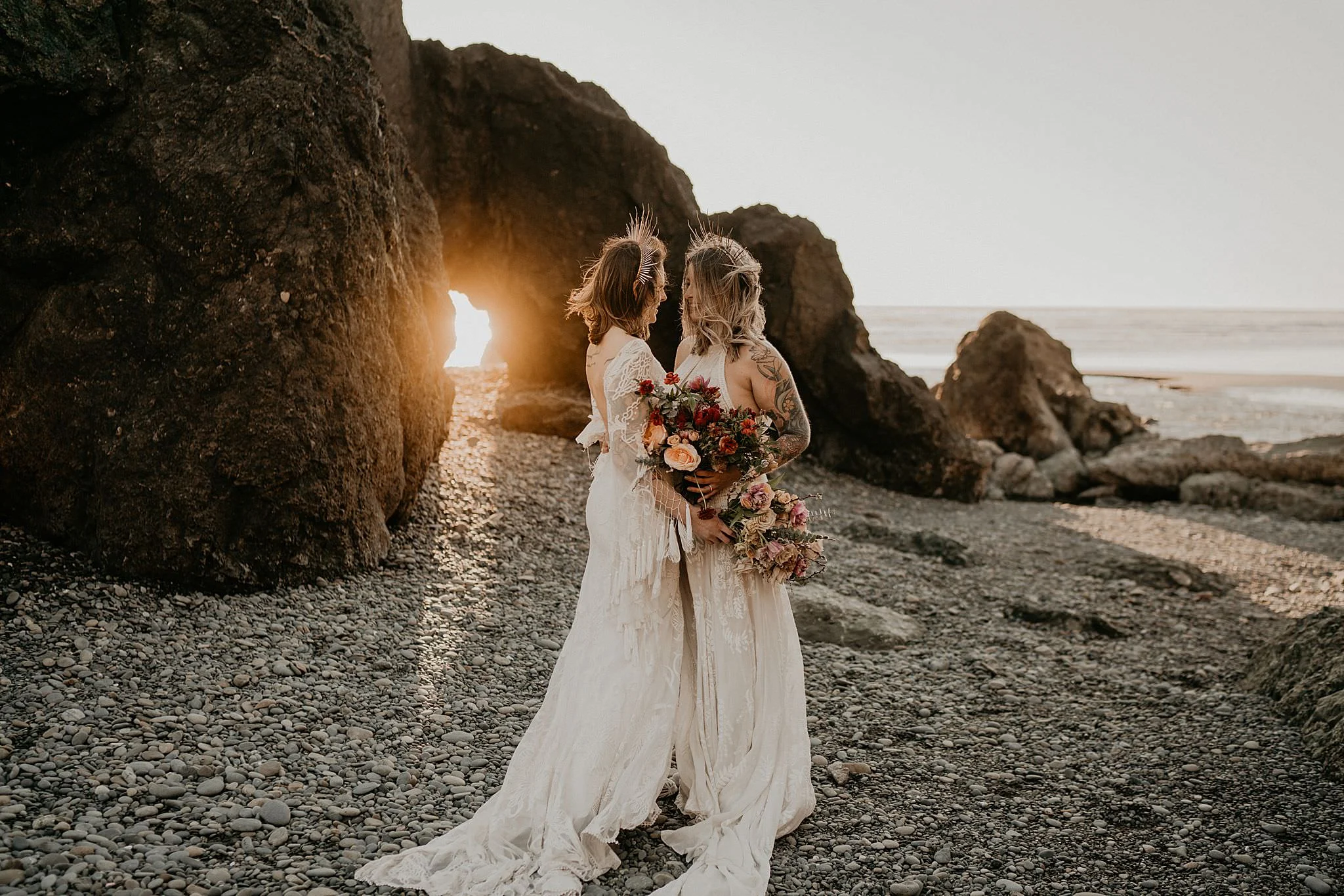 Lesbian brides at Ruby Beach elopement wearing bohemian Rue de seine dress from Seattle Dress Theory