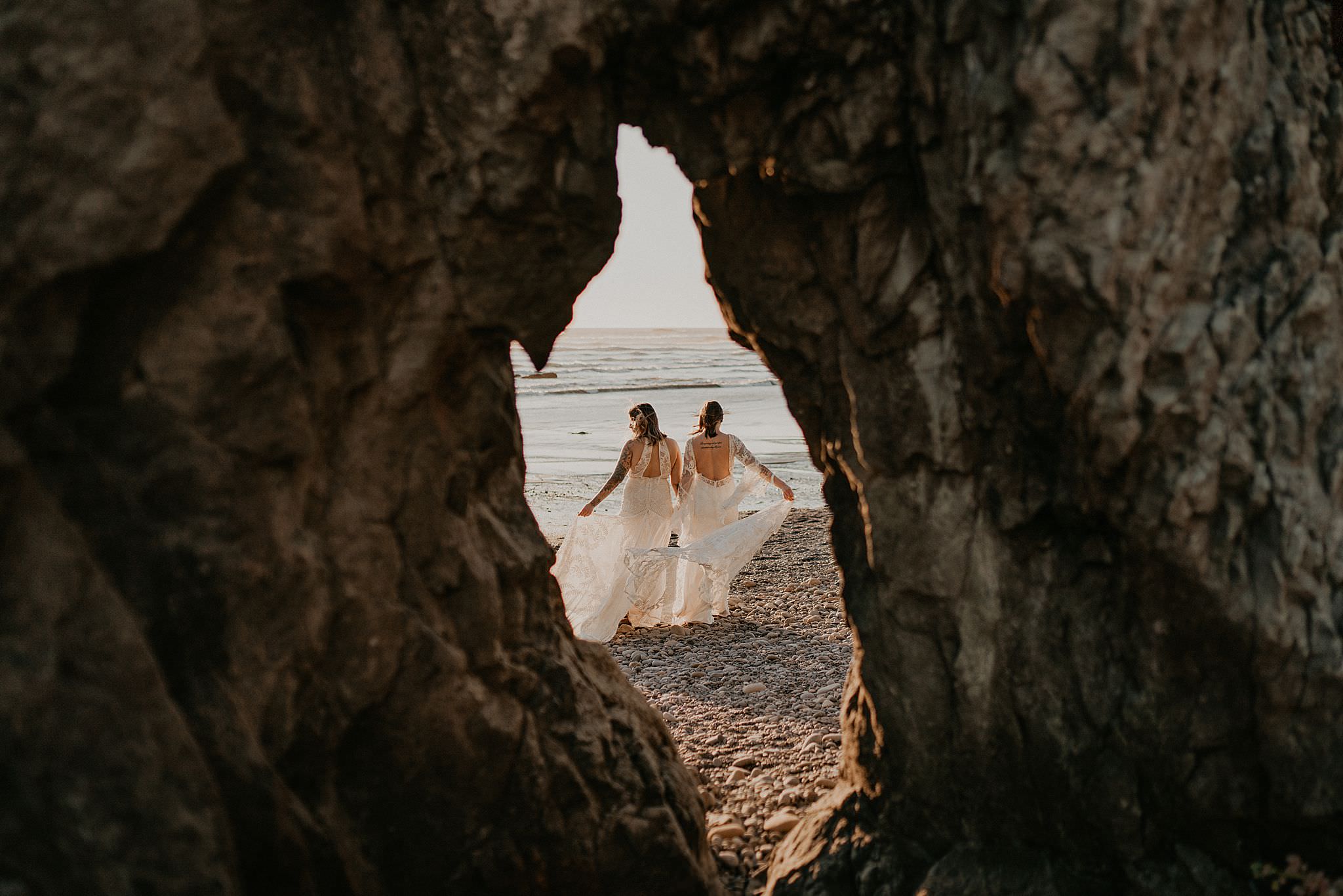 Lesbian brides at Ruby Beach elopement wearing bohemian Rue de seine dress from Seattle Dress Theory