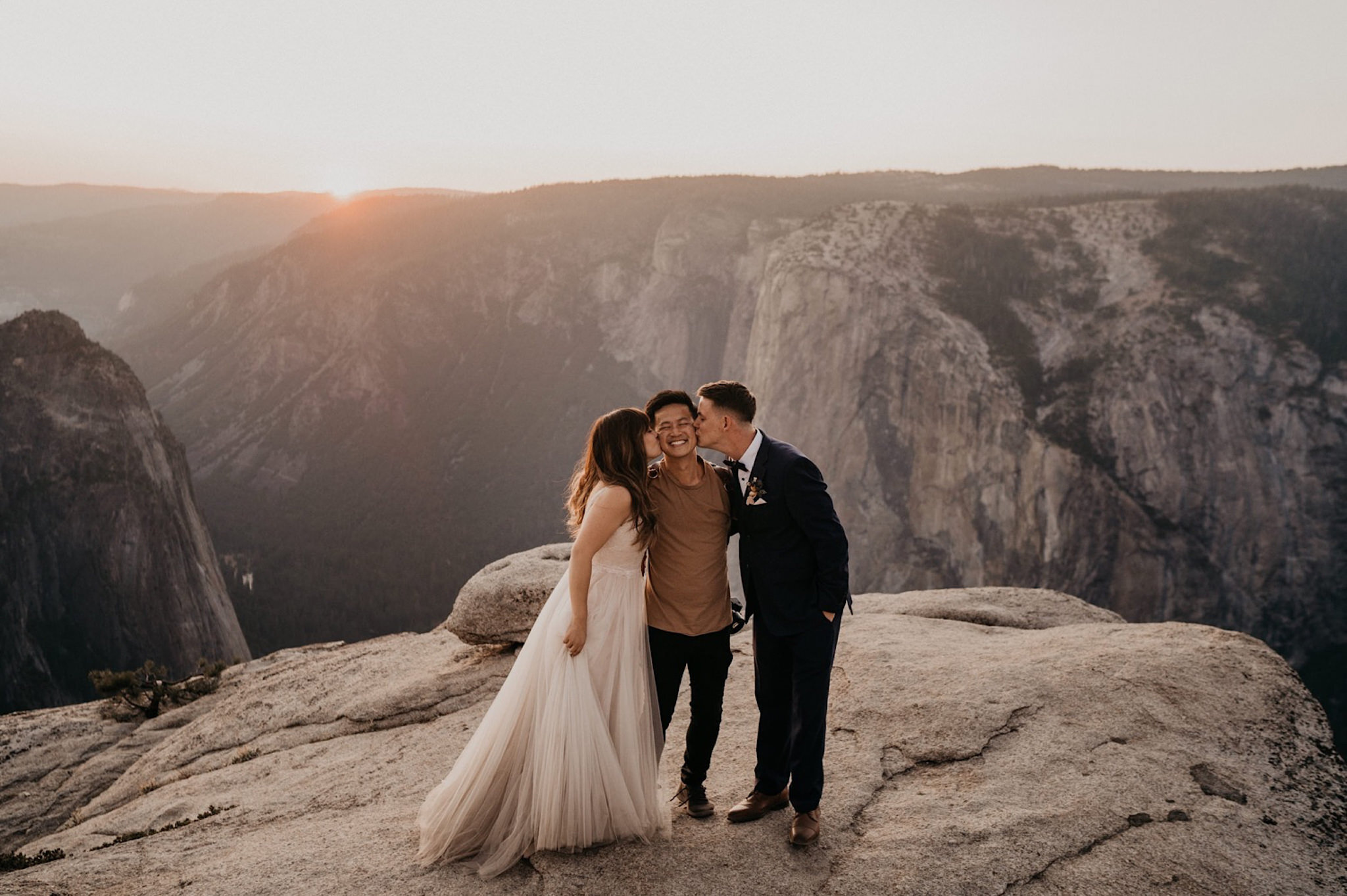 Henry Tieu Photography and bride and groom kissing him at Yosemite National Park during their wedding and elopement