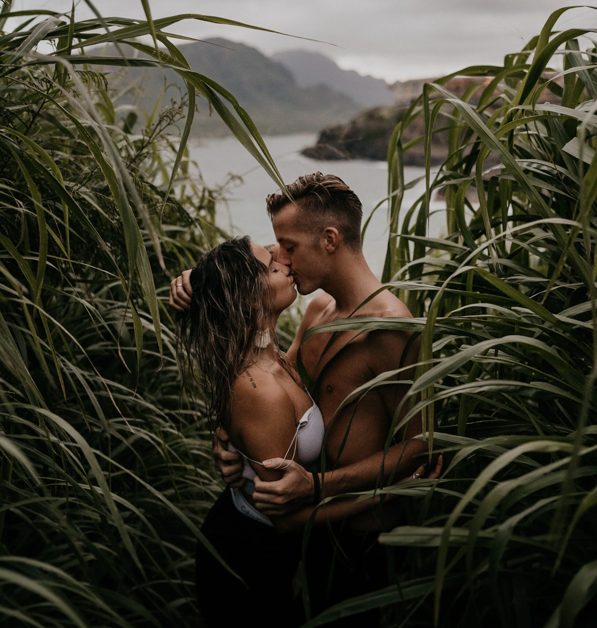 Kauai engagement photographer in front of a tropical lush green nature