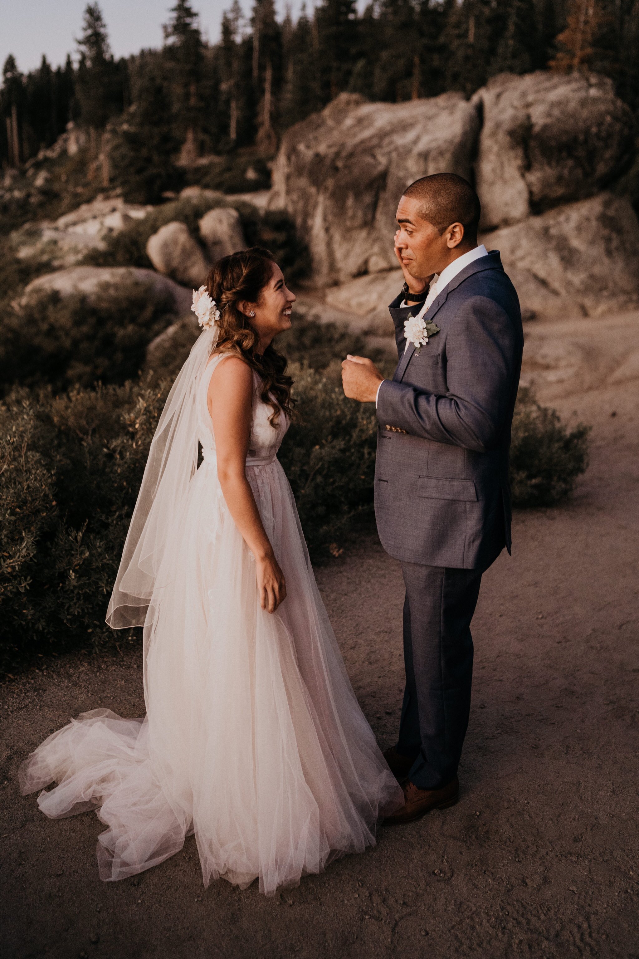 Emotional First look photos of bride and groom crying on their adventure elopement at Yosemite National Park Glacier Point