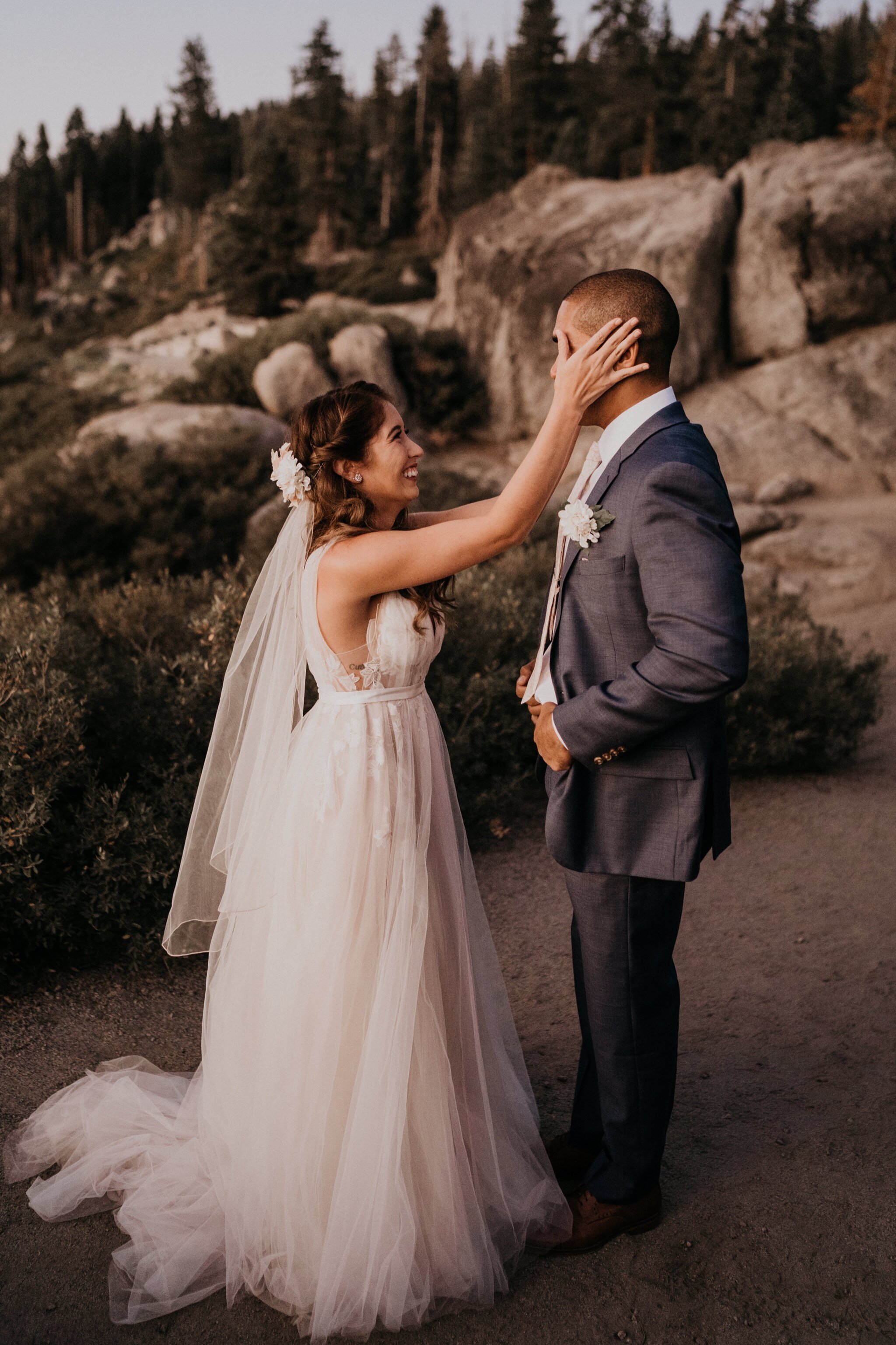 Emotional First look photos of bride and groom crying on their adventure elopement at Yosemite National Park Glacier Point