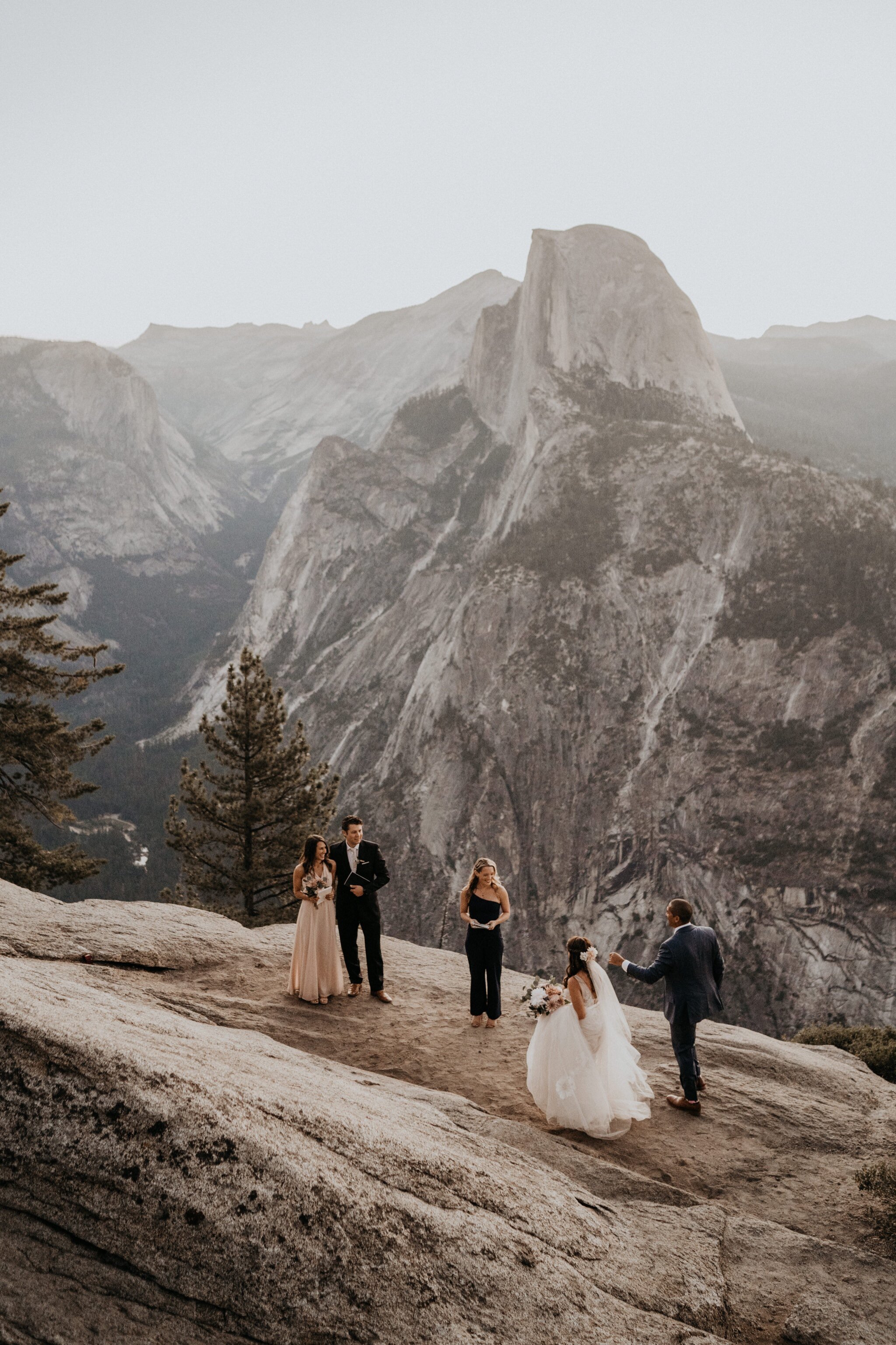 Yosemite National Park elopement photos at Glacier Point during sunrise with view of Half Dome