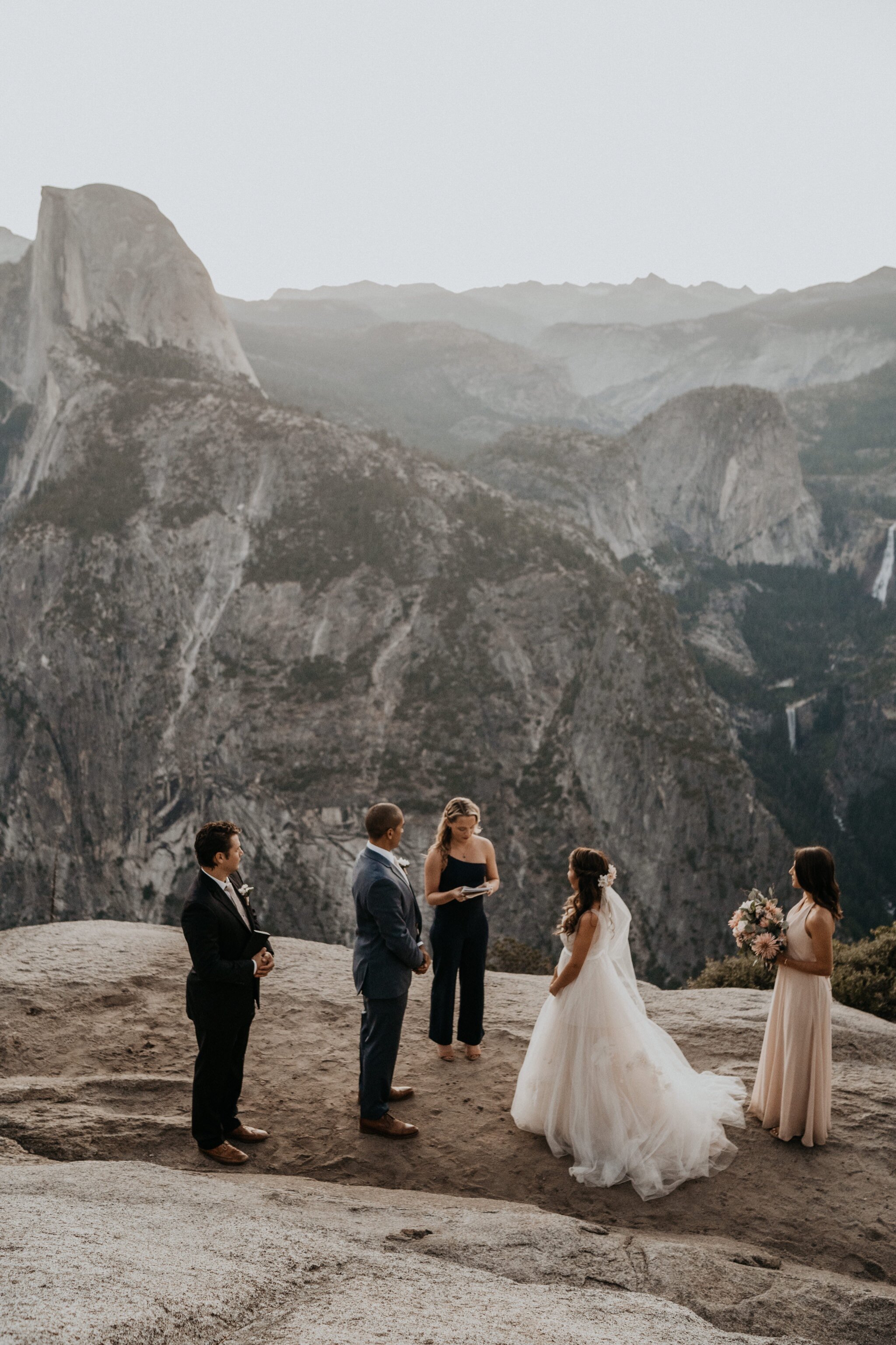 Yosemite National Park elopement and wedding photos at Glacier Point during sunrise with view of Half Dome