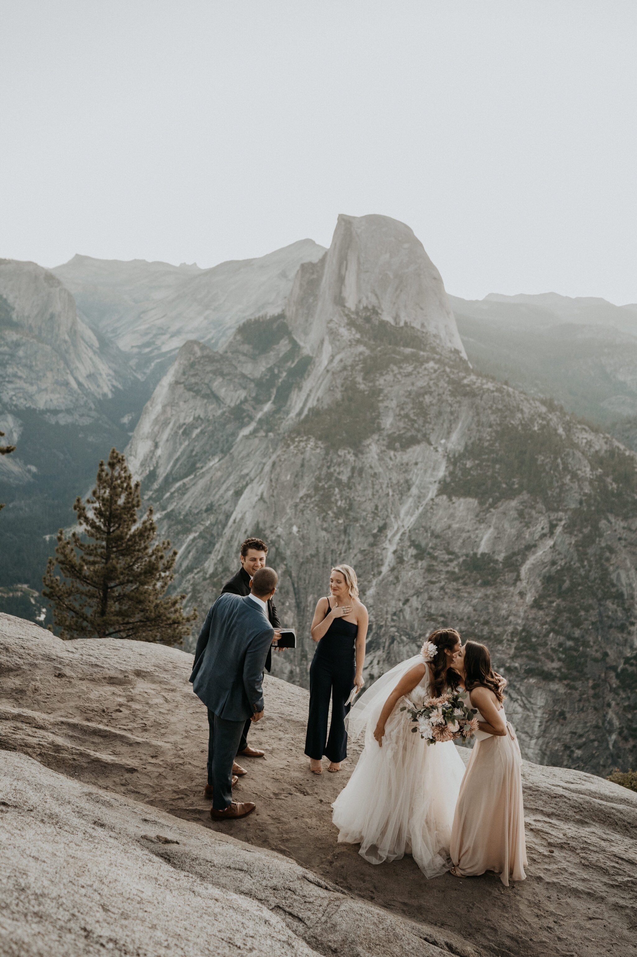 Yosemite National Park elopement and wedding photos at Glacier Point during sunrise with view of Half Dome