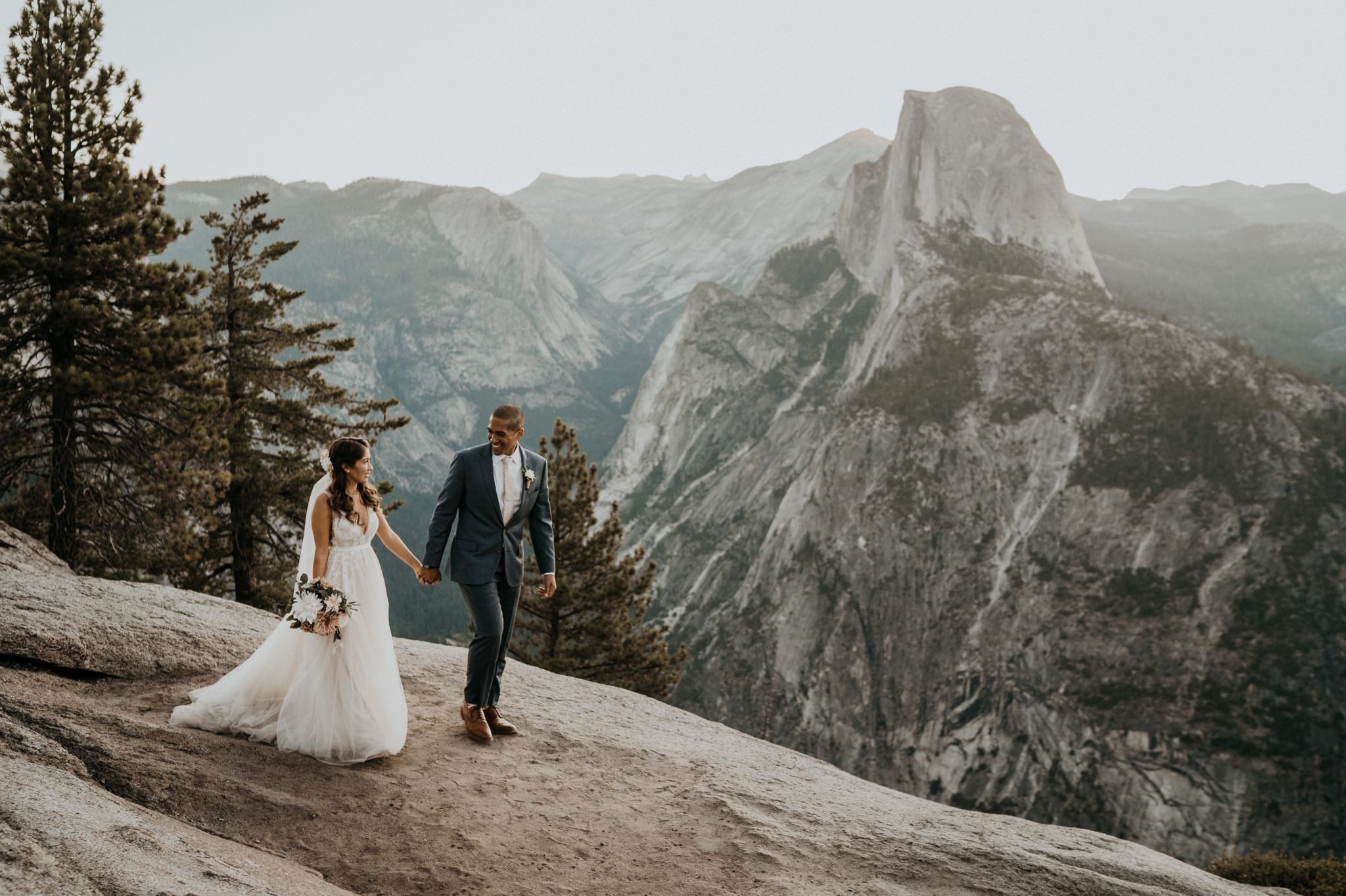 Yosemite National Park elopement and wedding photos at Glacier Point during sunrise with view of Half Dome