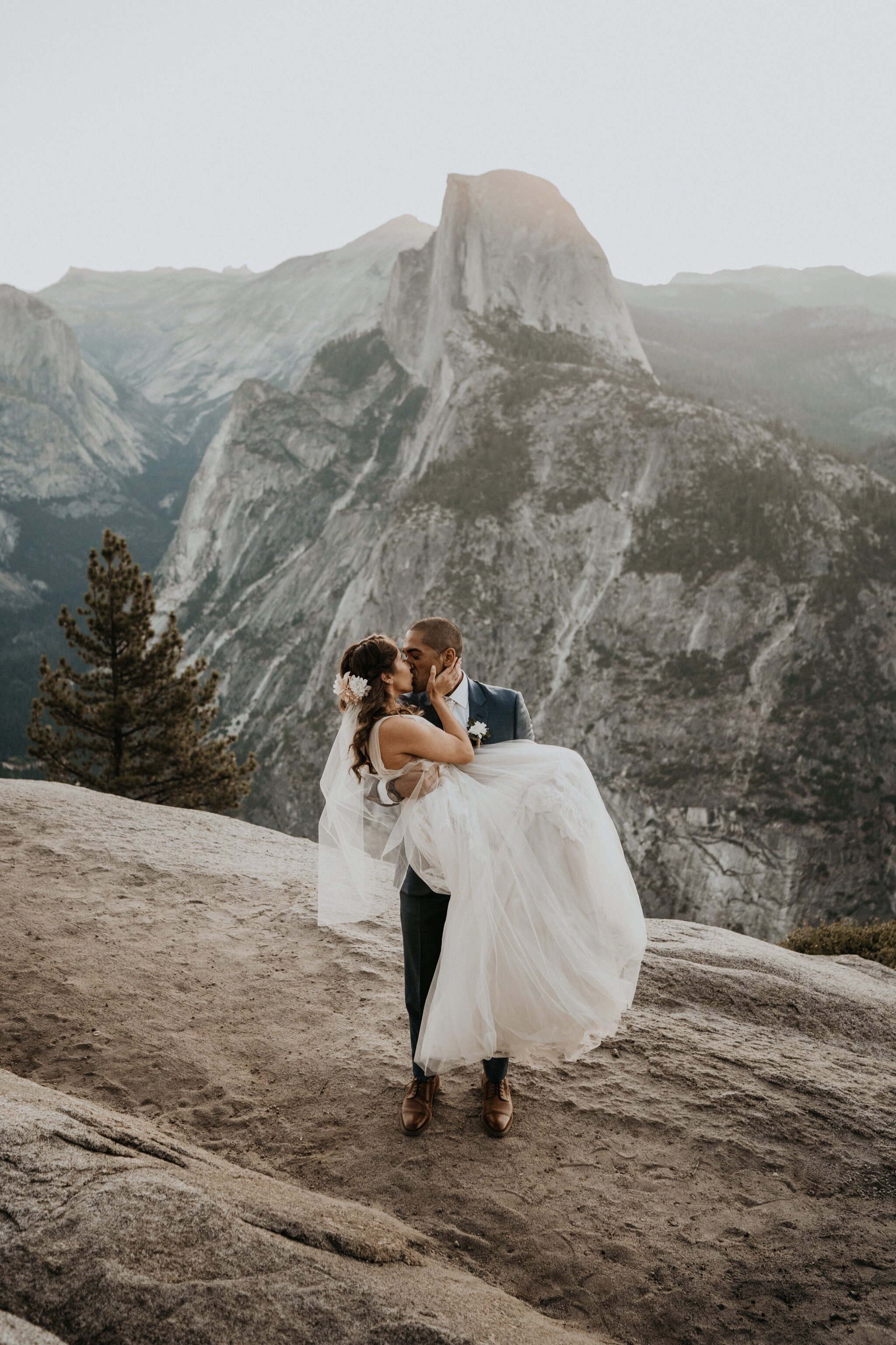 Yosemite National Park elopement and wedding photos at Glacier Point during sunrise with view of Half Dome