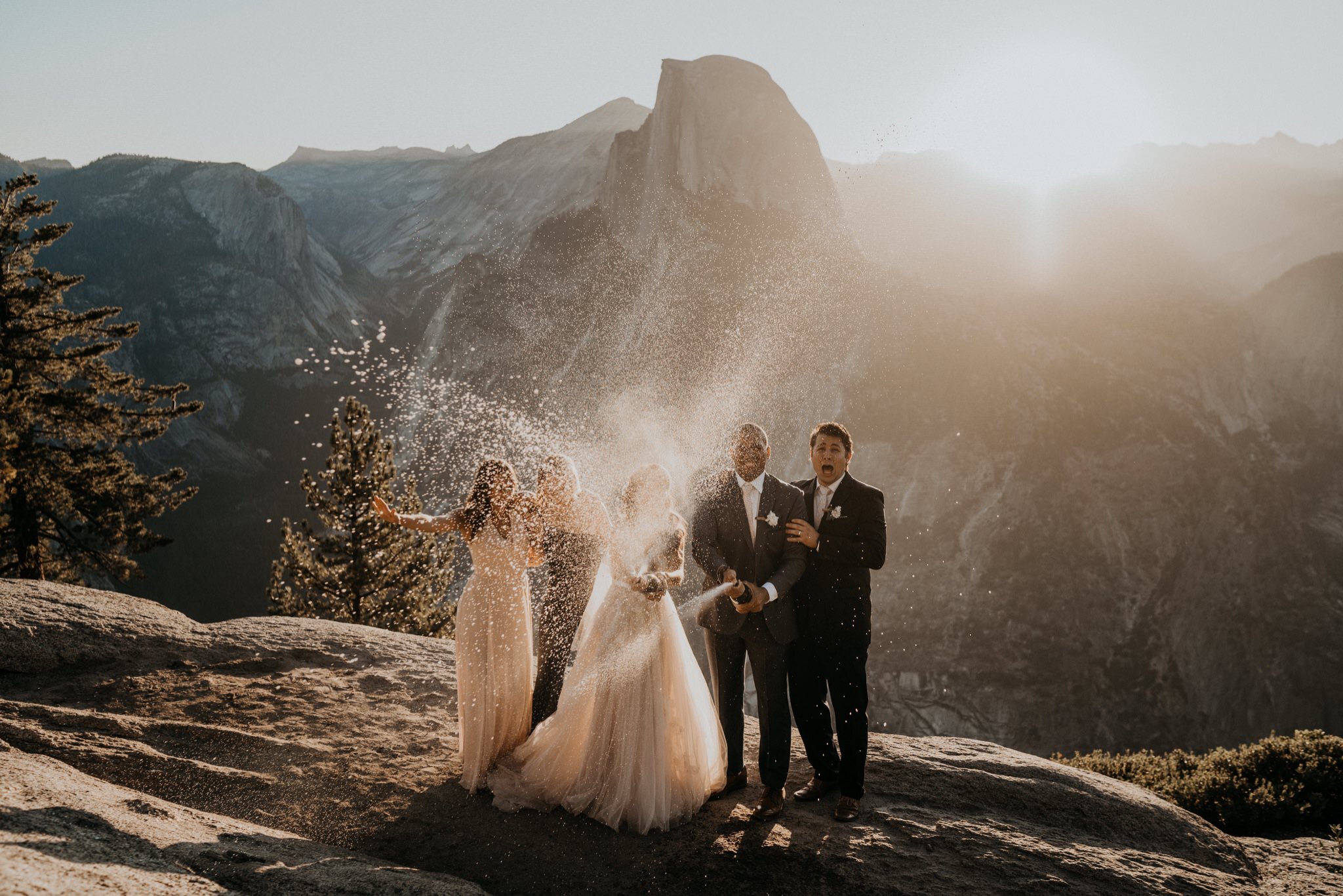 Intimate elopement with friends and family members | Yosemite National Park elopement and wedding photos at Glacier Point during sunrise with view of Half Dome