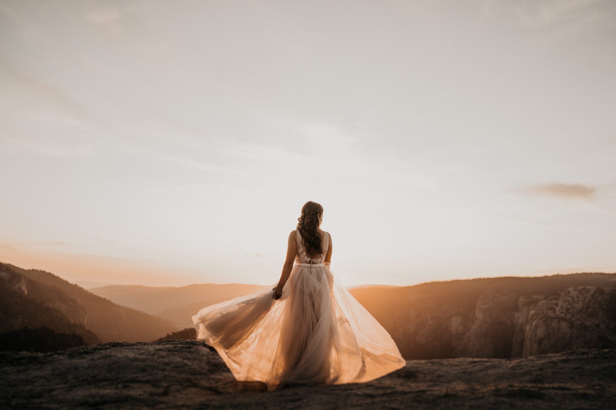 Beautiful sunset photos at Taft Point on their elopement day at Yosemite National Park