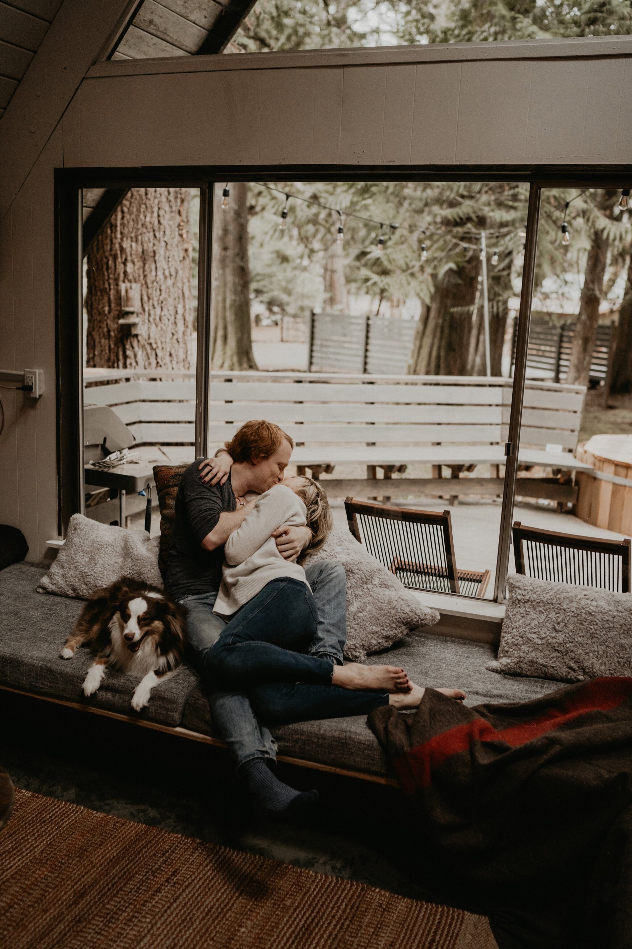 Couple stay in a hot tub for their Intimate steamy in-home engagement session at an A-Frame Cabin in Mount Rainier National Park