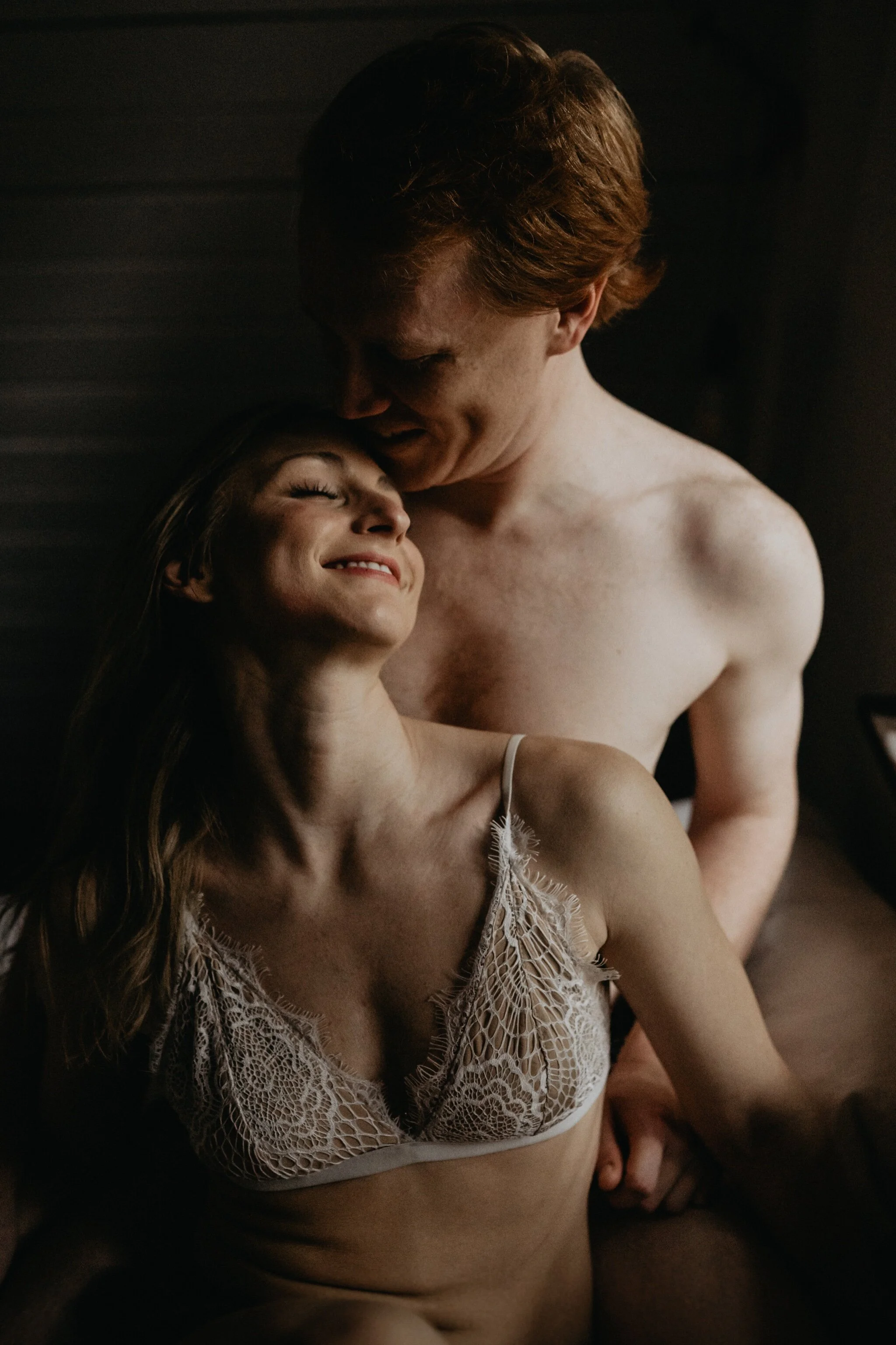 Couple stay in a hot tub for their Intimate steamy in-home engagement session at an A-Frame Cabin in Mount Rainier National Park