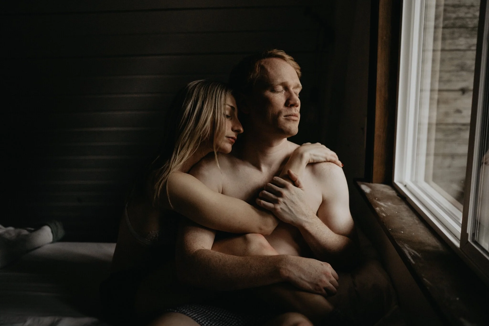 Couple stay in a hot tub for their Intimate steamy in-home engagement session at an A-Frame Cabin in Mount Rainier National Park