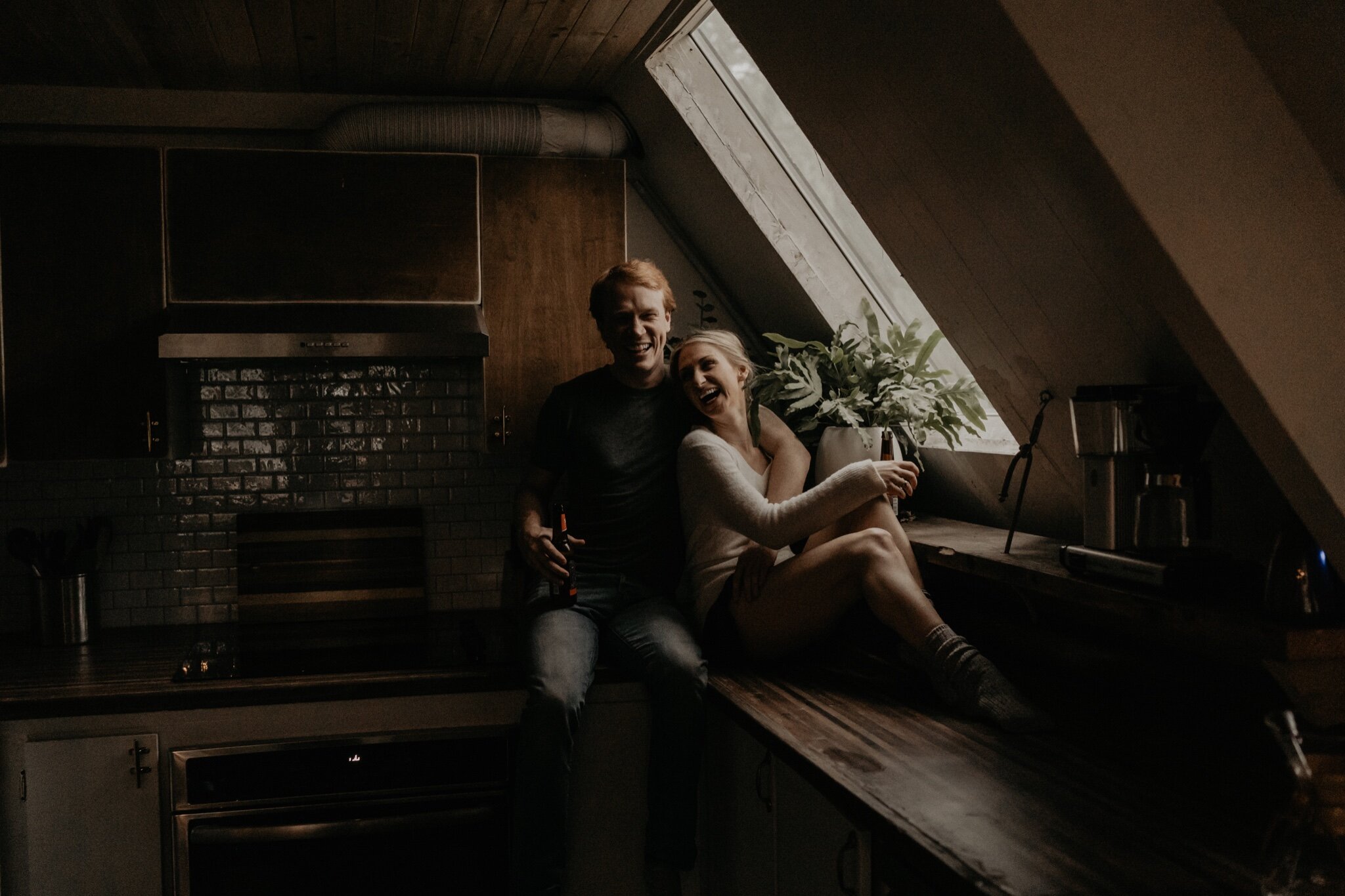 Couple stay in a hot tub for their Intimate steamy in-home engagement session at an A-Frame Cabin in Mount Rainier National Park