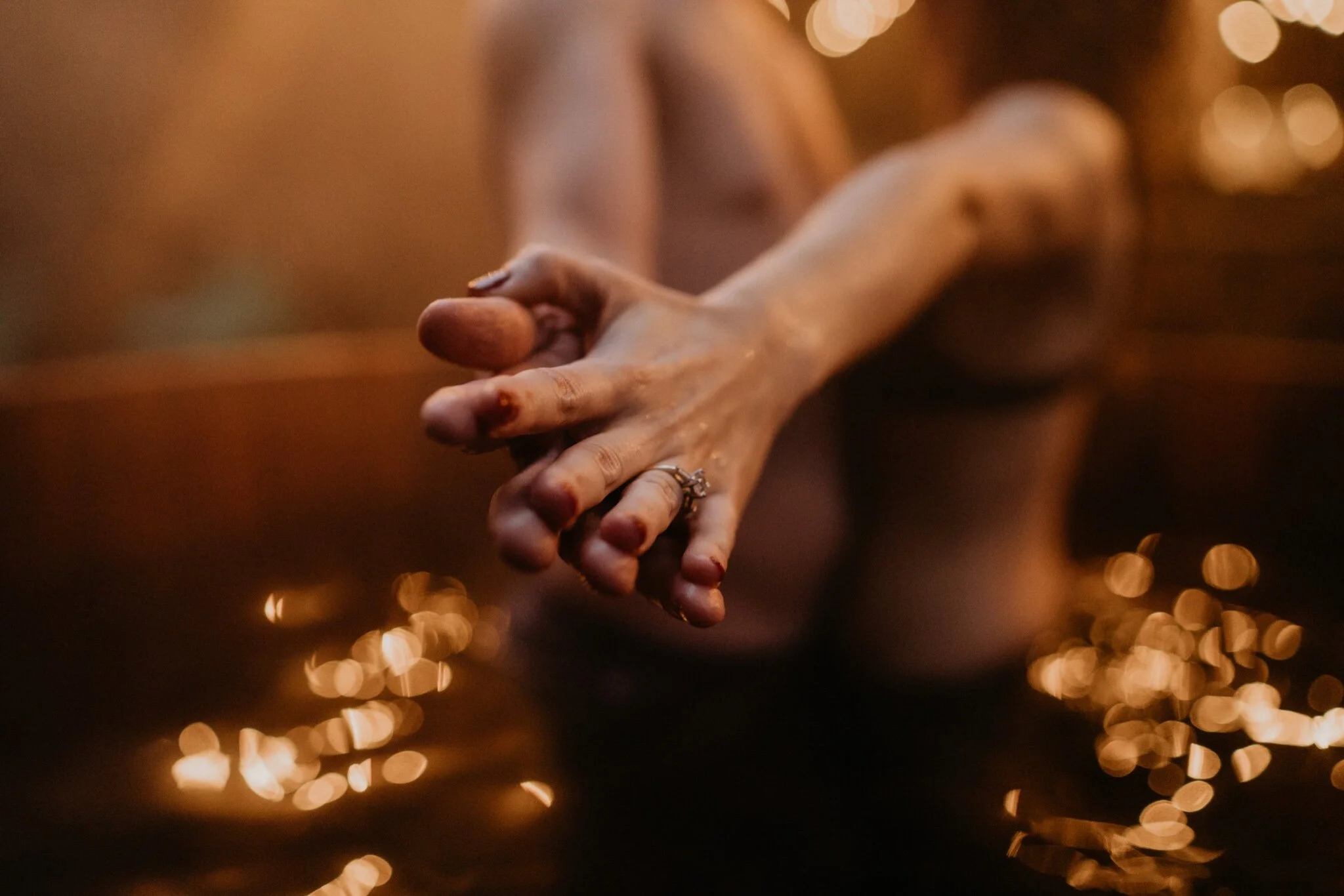 Couple stay in a hot tub for their Intimate steamy in-home engagement session at an A-Frame Cabin in Mount Rainier National Park