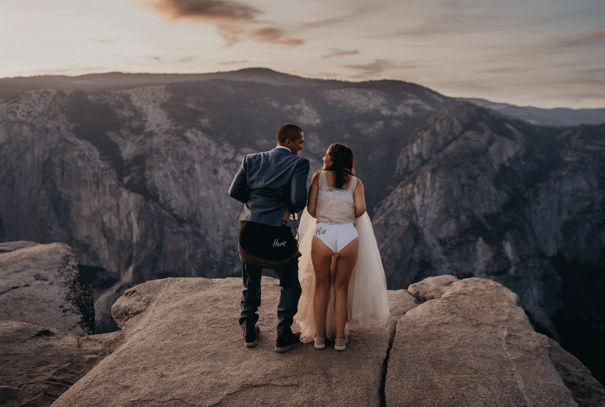 Couple twerks at Taft Point in their matching underwear during their Yosemite elopement.