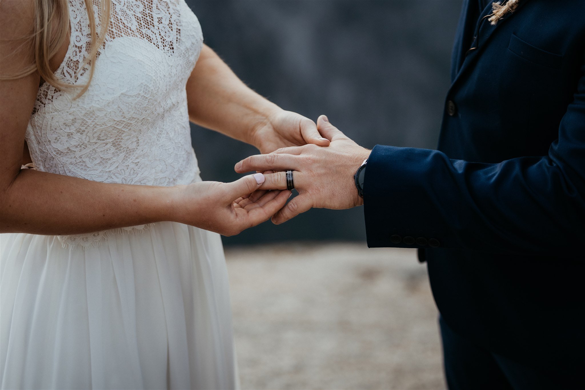 Couple exchanging rings during elopement ceremony