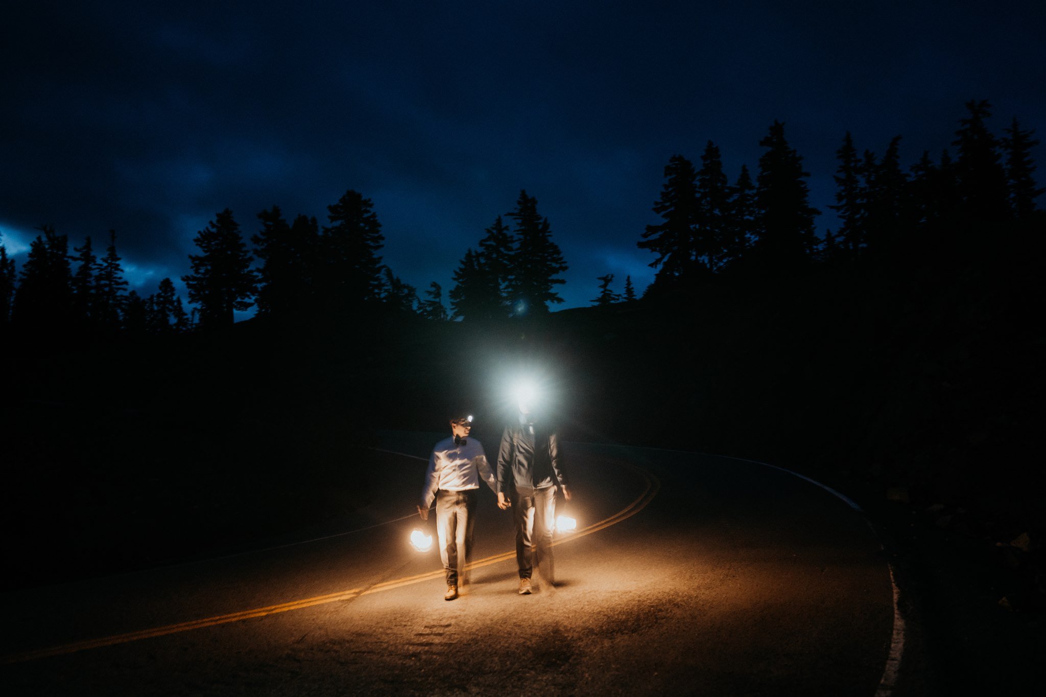 Two grooms walking up the North Cascade mountains for their sunrise elopement