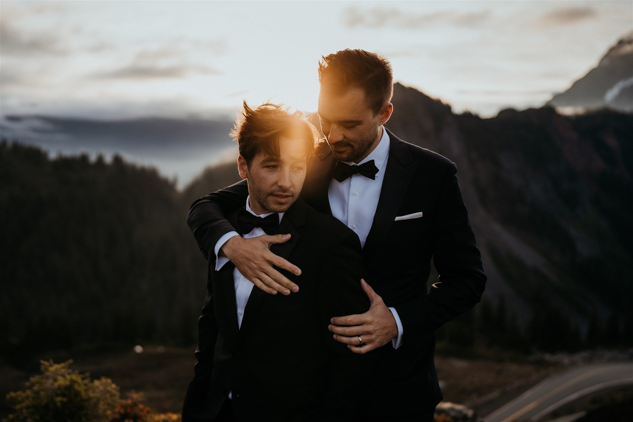 Two grooms embrace during their mountain elopement in the North Cascades