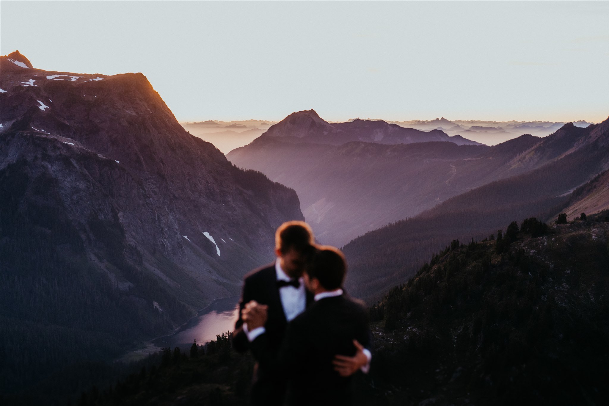 Two grooms dancing in the mountains for their North Cascades elopement