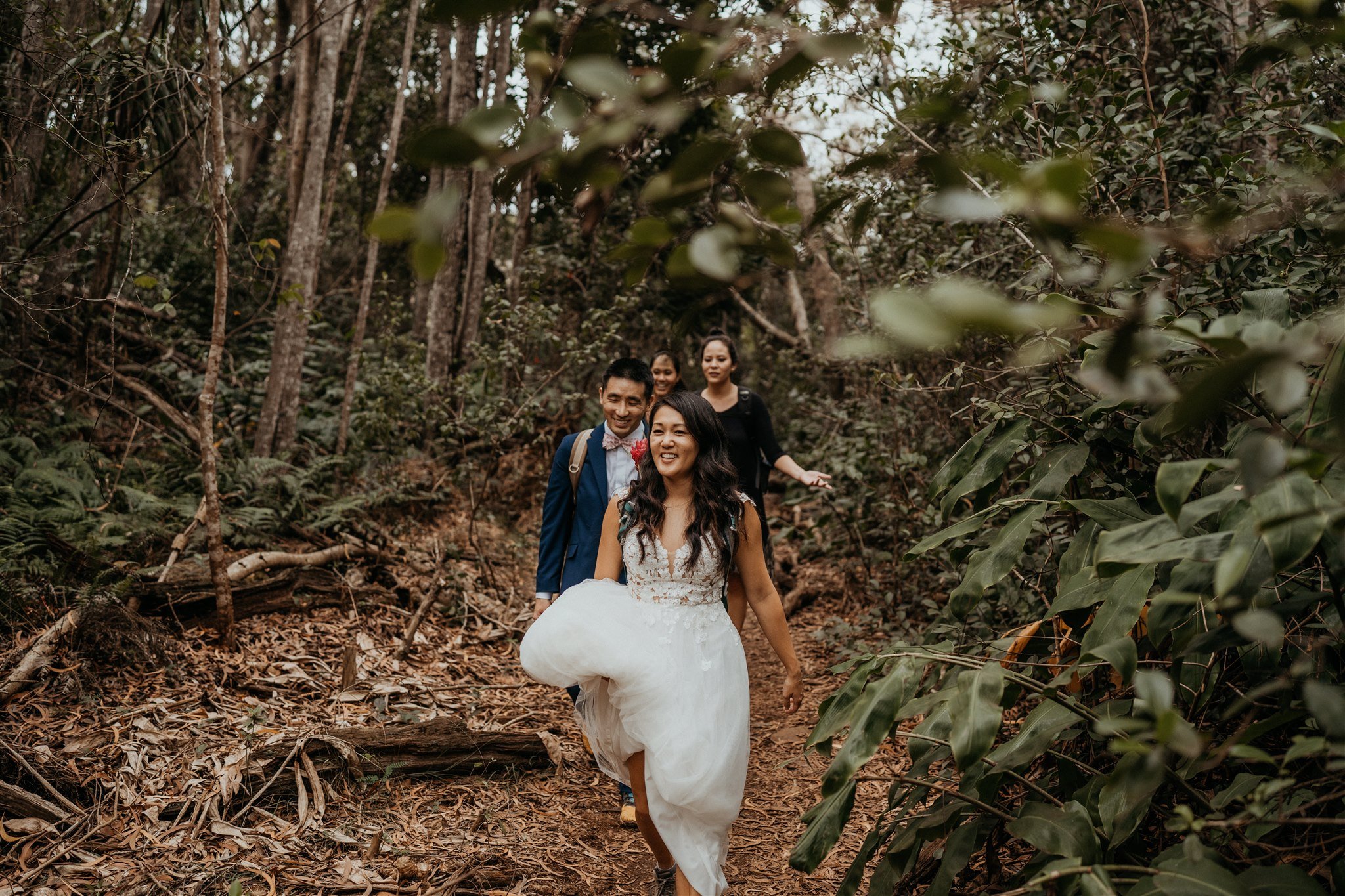 Bride, groom and friends hiking in Kauai for their Hawaii adventure elopement