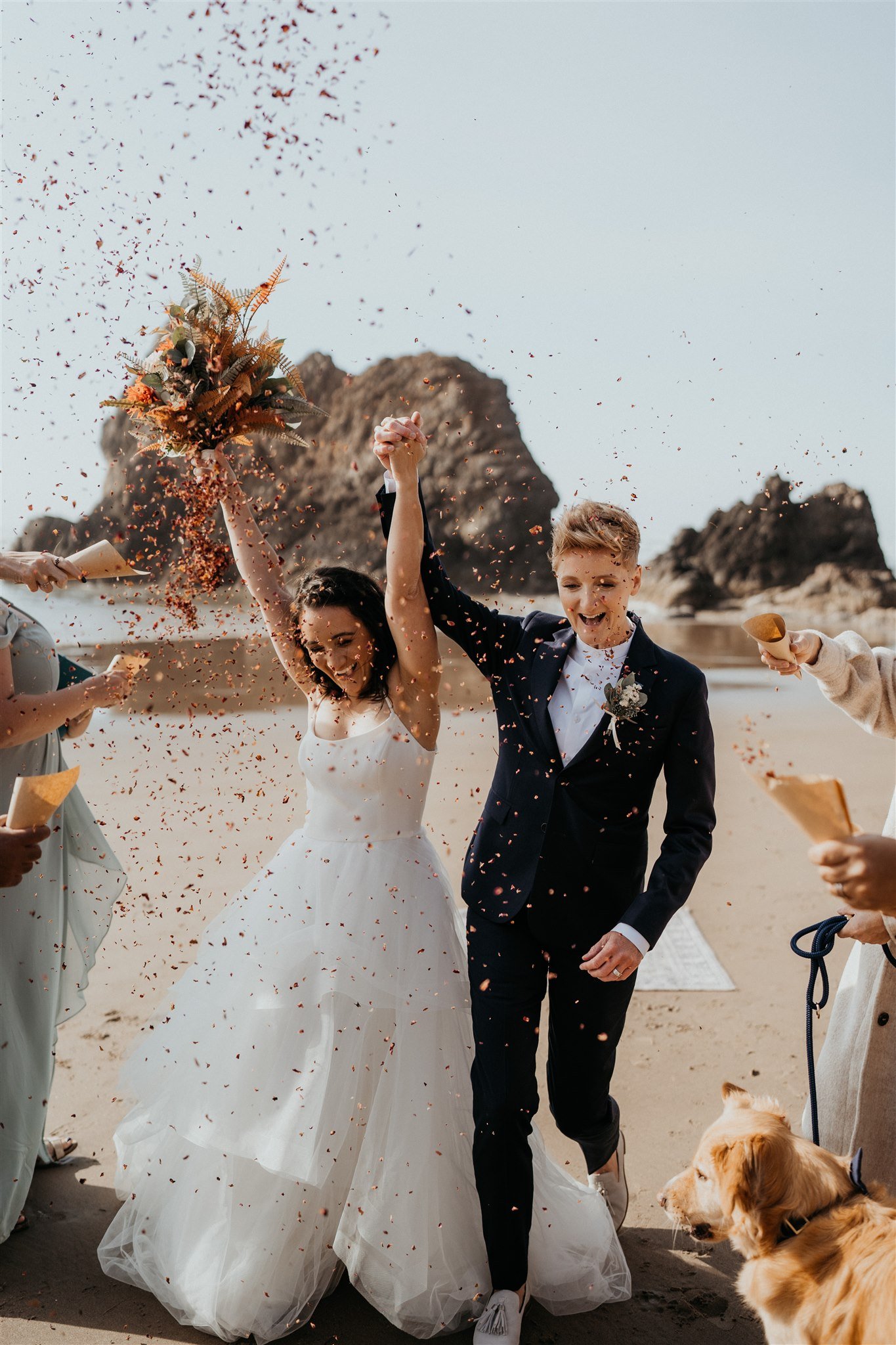 Two brides celebrate after their Oregon Coast elopement ceremony