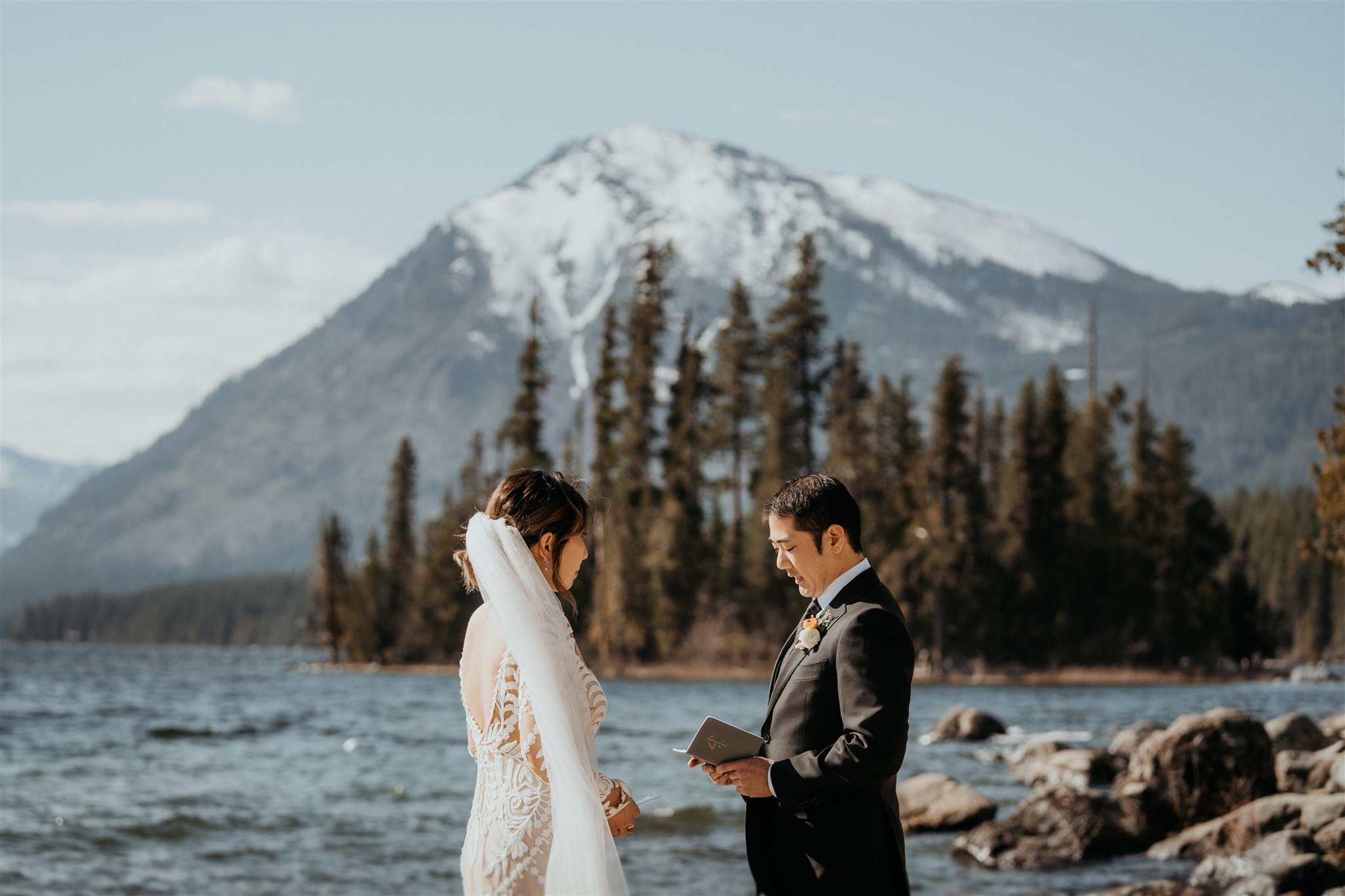 Bride and groom exchange vows at Lake Wenatchee in the North Cascades