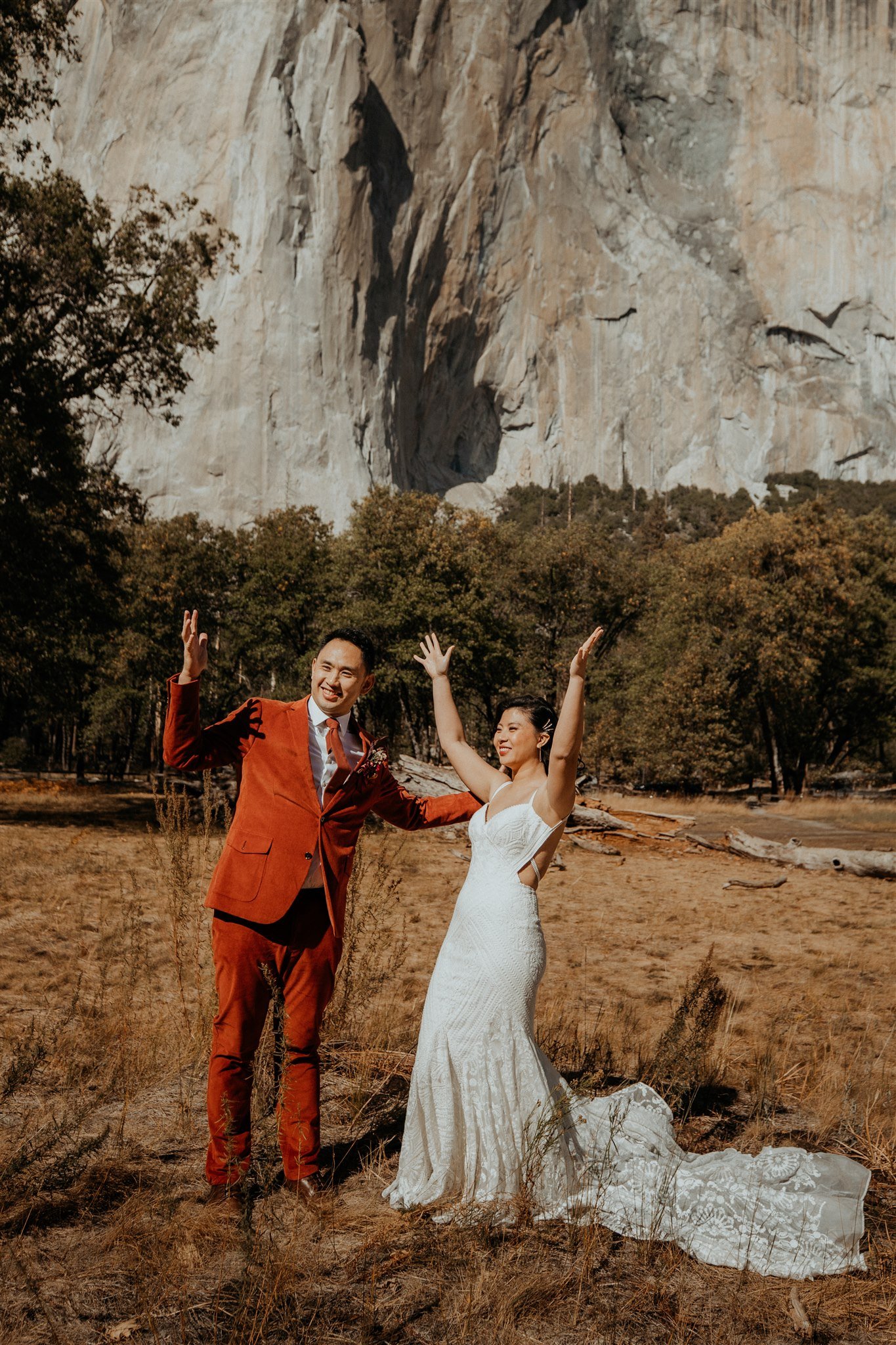 Bride and groom cheering after wedding ceremony at Yosemite National Park