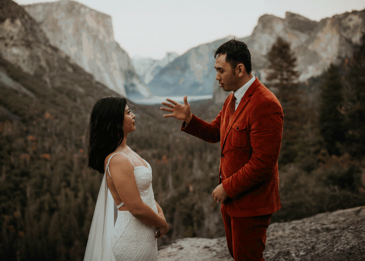 Groom signing to bride after first look at Yosemite National Park