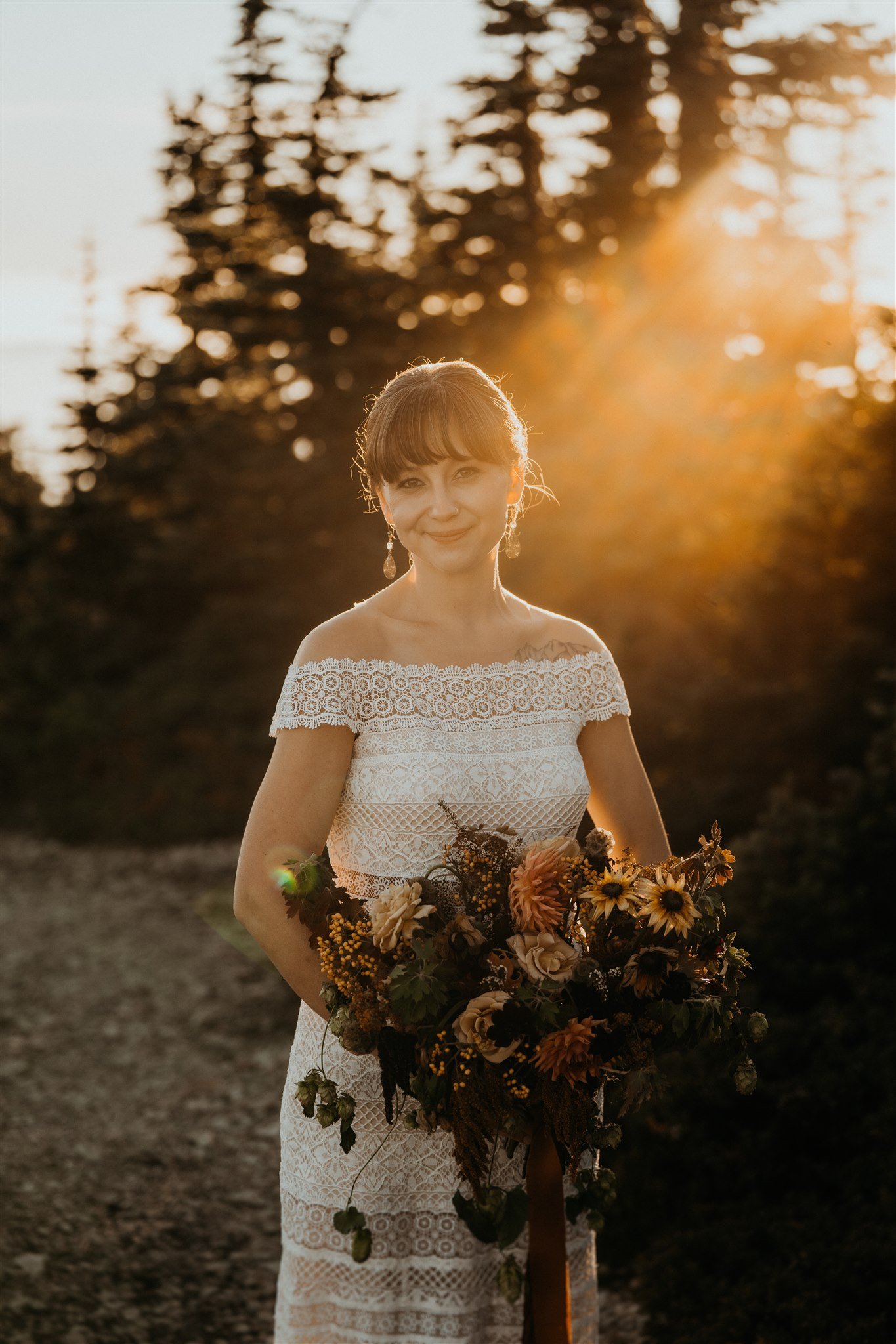 Bride holding autumn colored wedding bouquet
