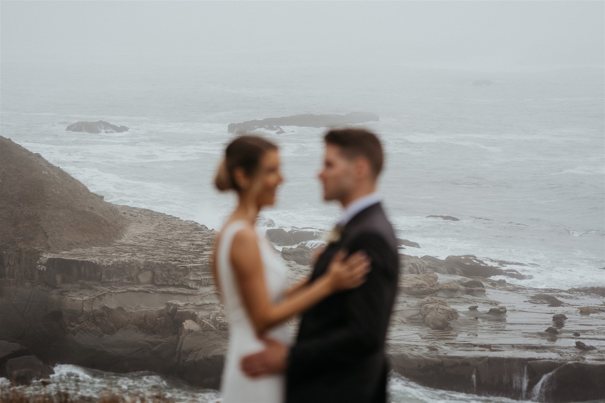 Bride and groom hug on the Southern Oregon Coast