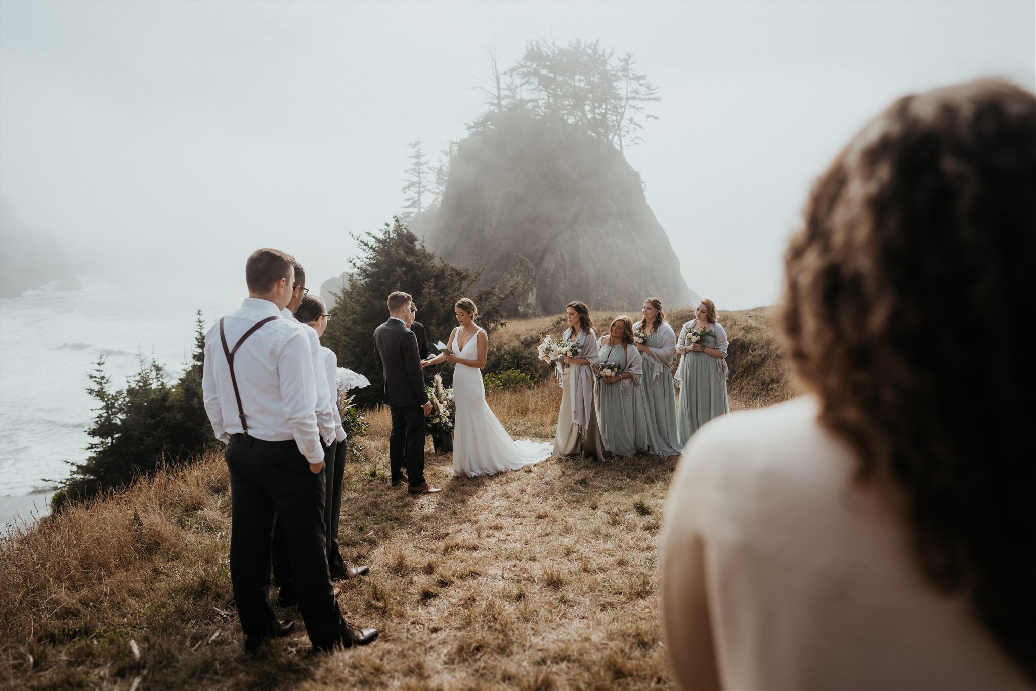 Bride reads vows to groom during outdoor intimate wedding ceremony on the Southern Oregon Coast