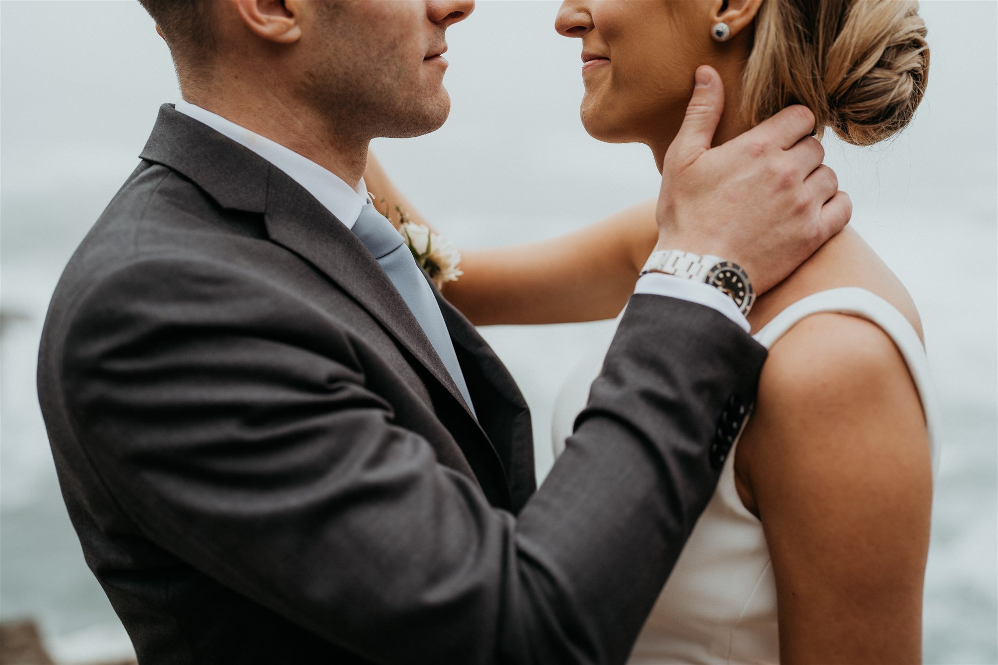 Bride and groom embracing during portrait session on the Oregon Coast