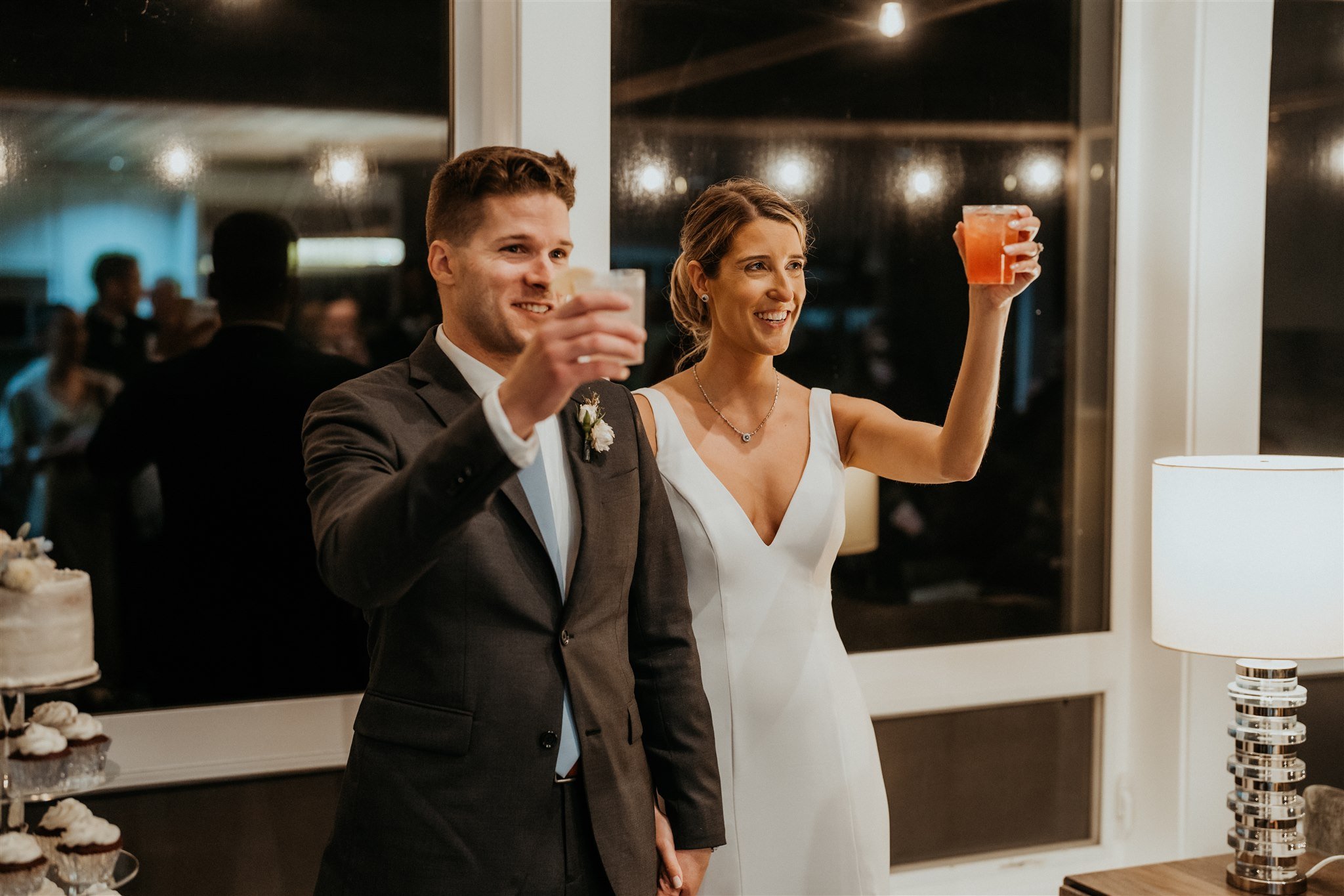 Bride and groom toasting guests at intimate wedding reception on the Southern Oregon Coast