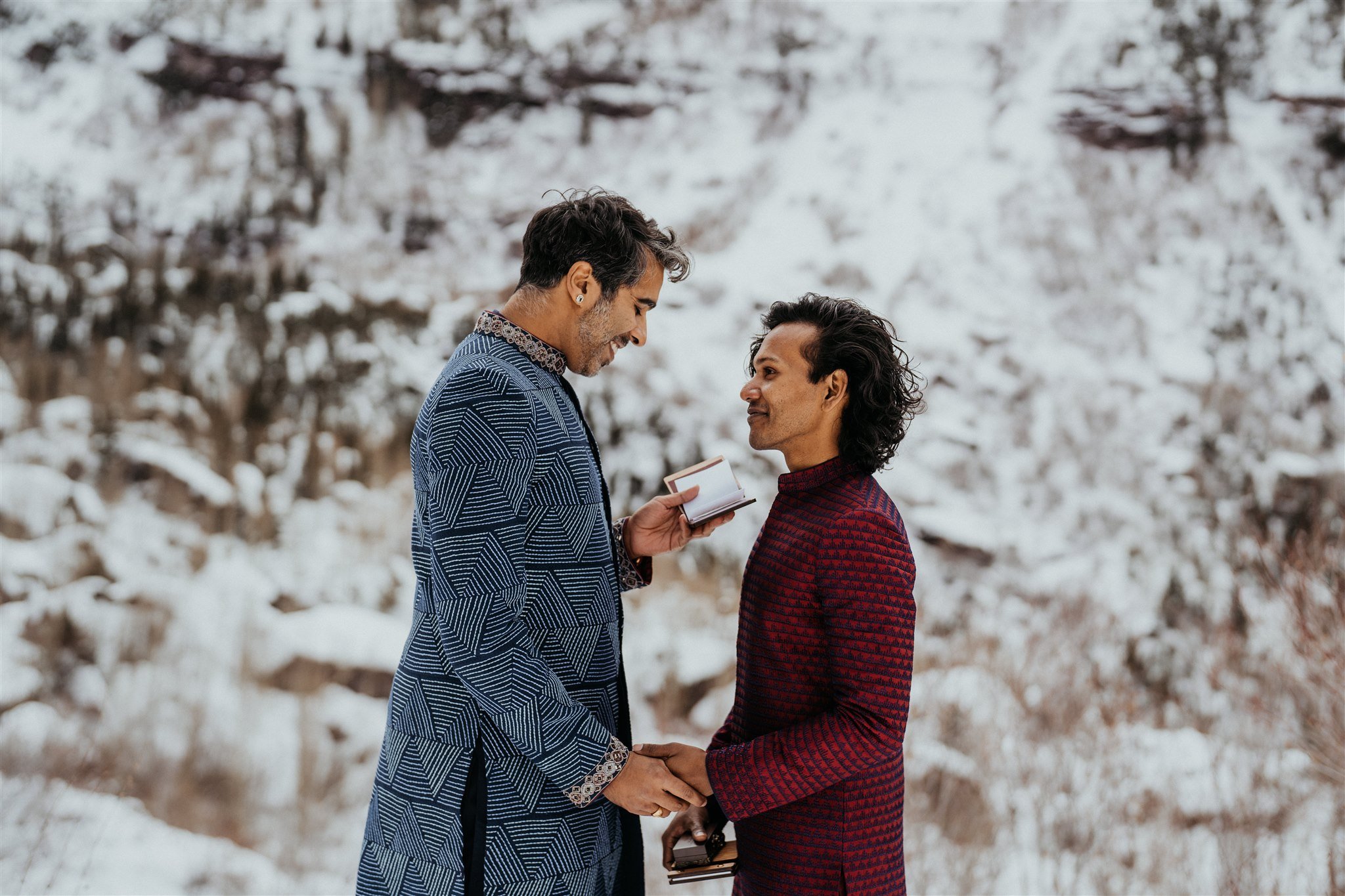 Groom reading vows to his partner in the Colorado mountains