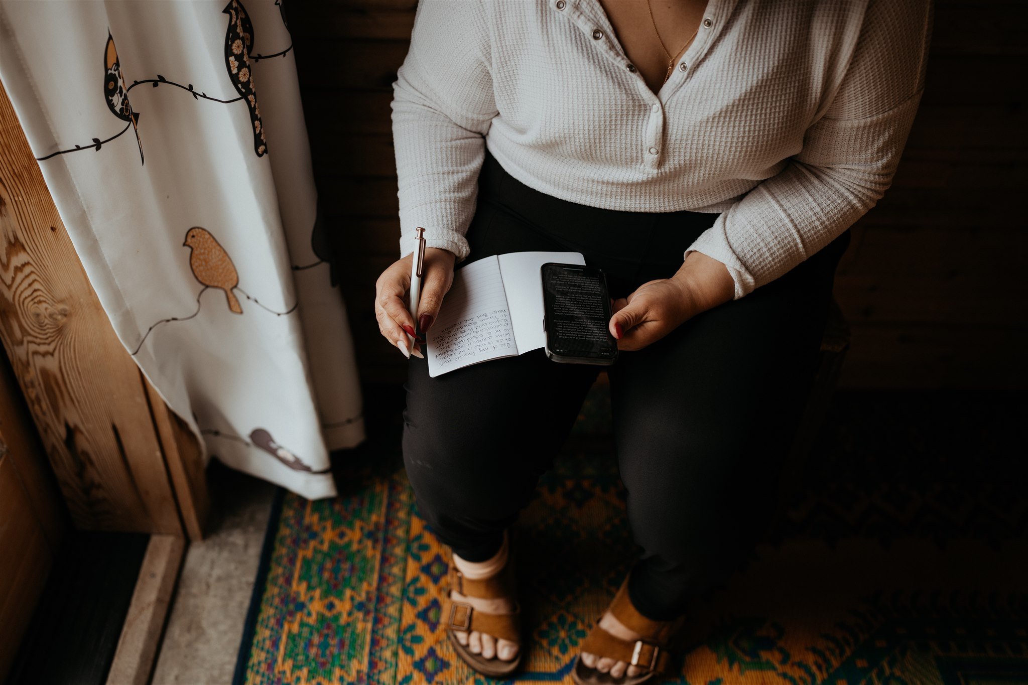 Bride writing wedding vows on the morning of PNW elopement