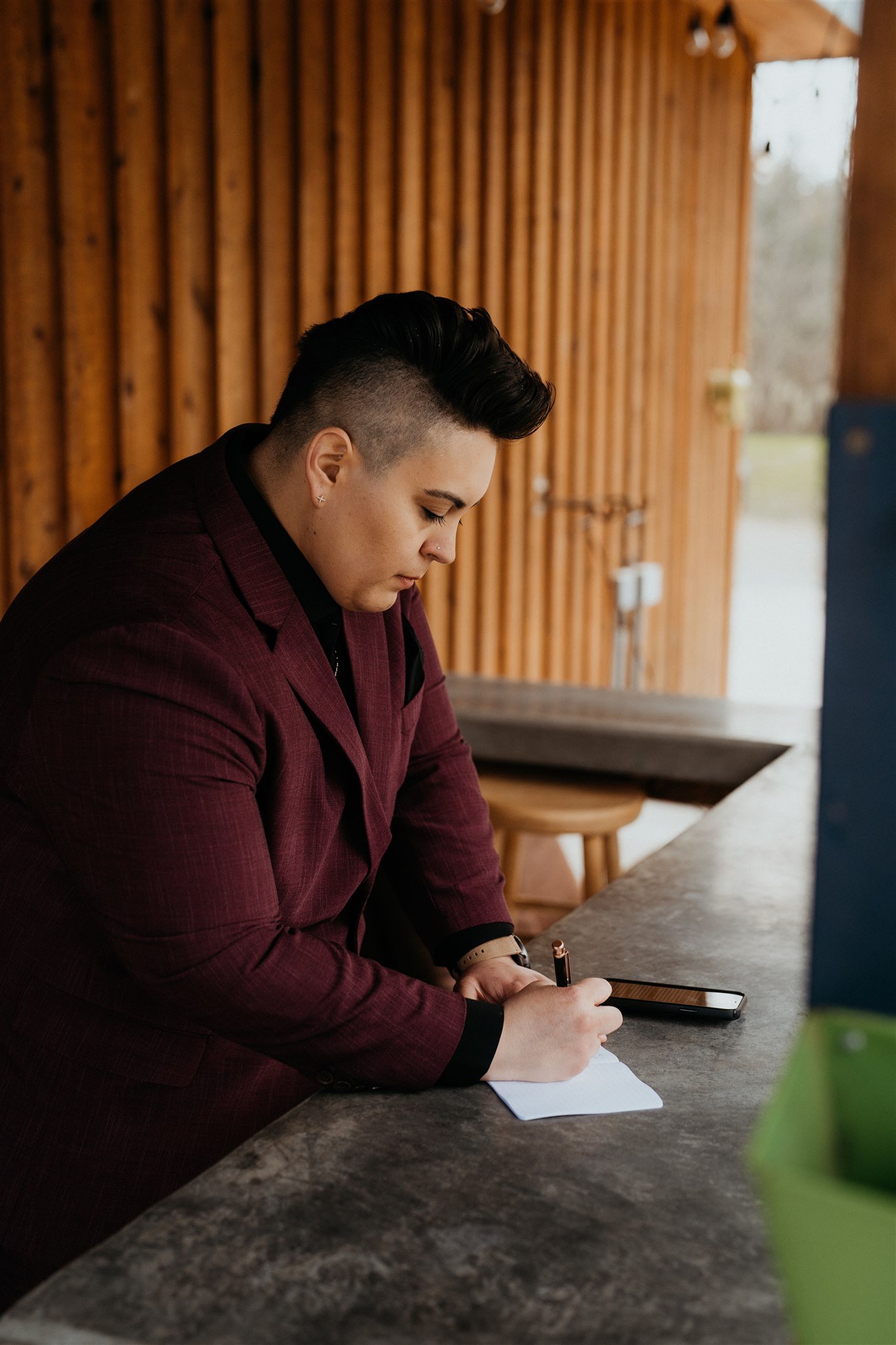 Bride writing wedding vows on the morning of PNW elopement