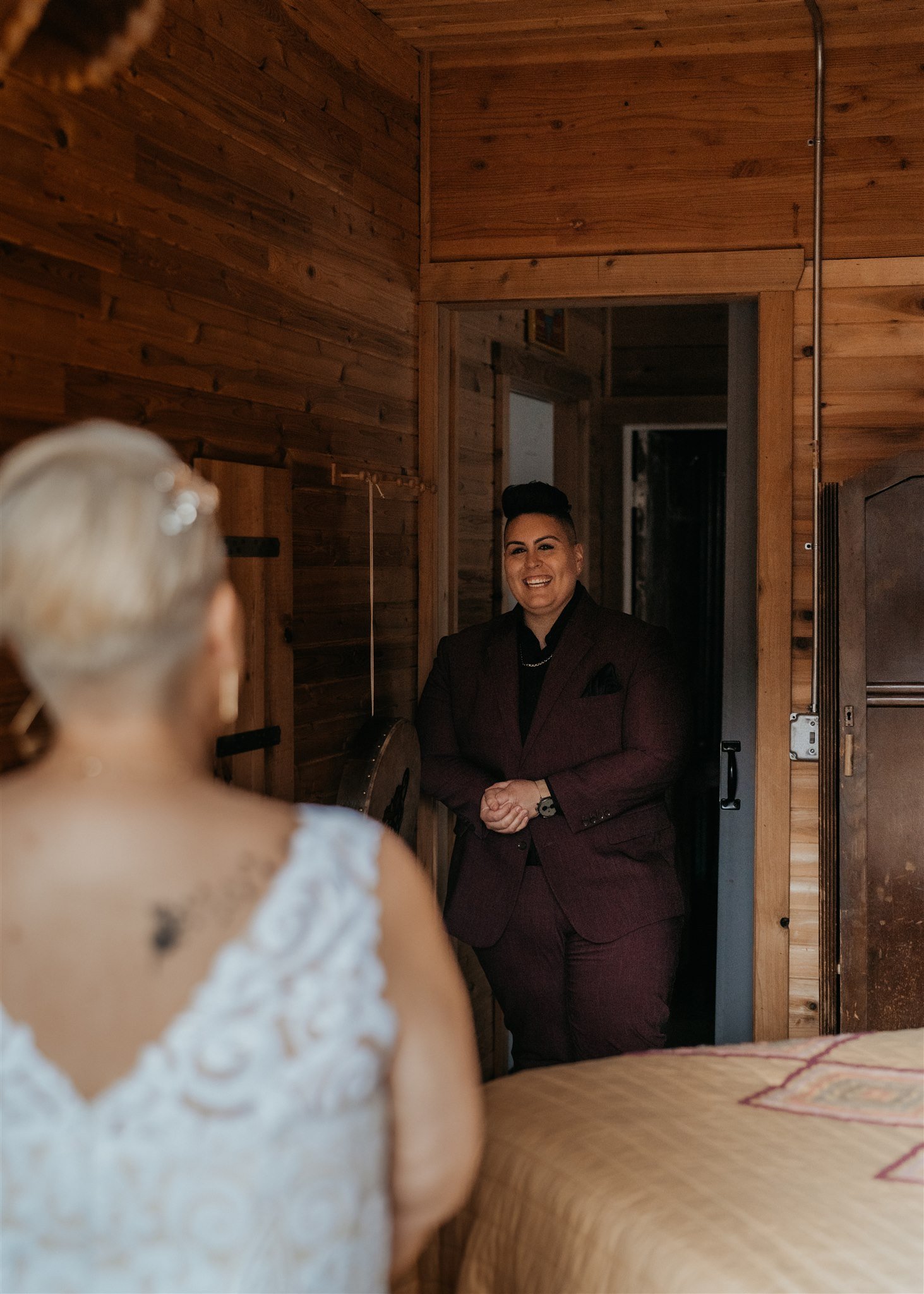 Two brides first look in PNW elopement cabin