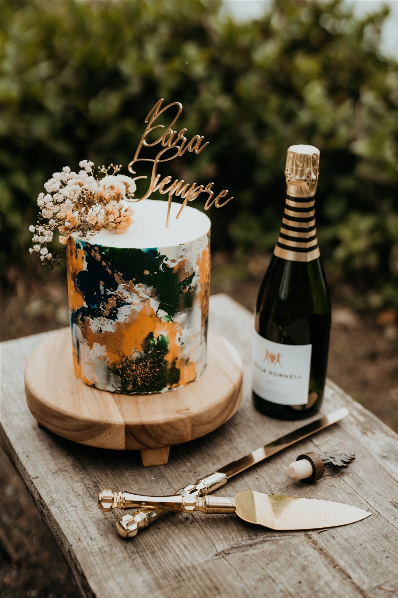 Green, gold, and white wedding cake for PNW elopement