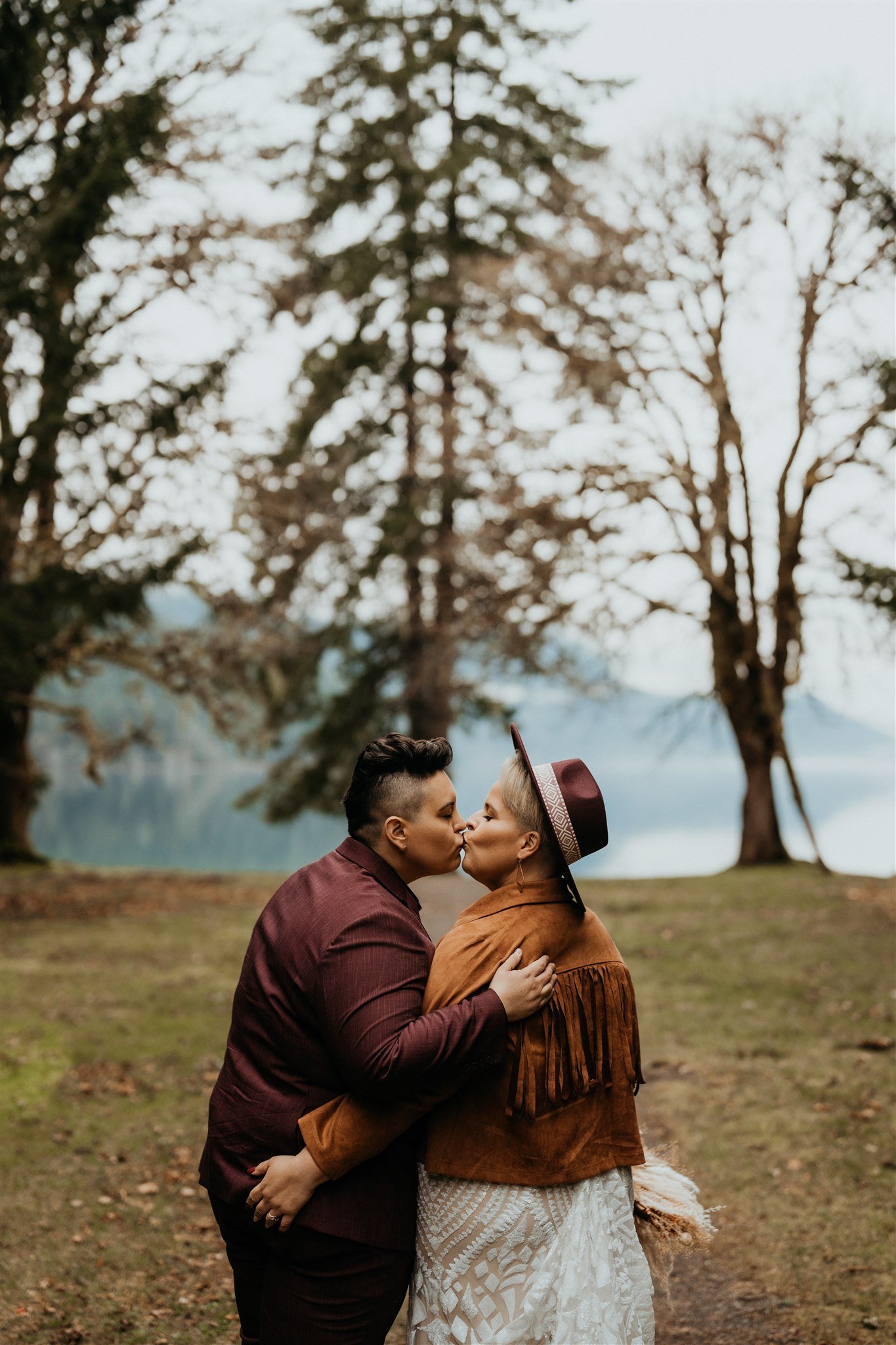 Two brides kissing during their Olympic National Park elopement at La Push