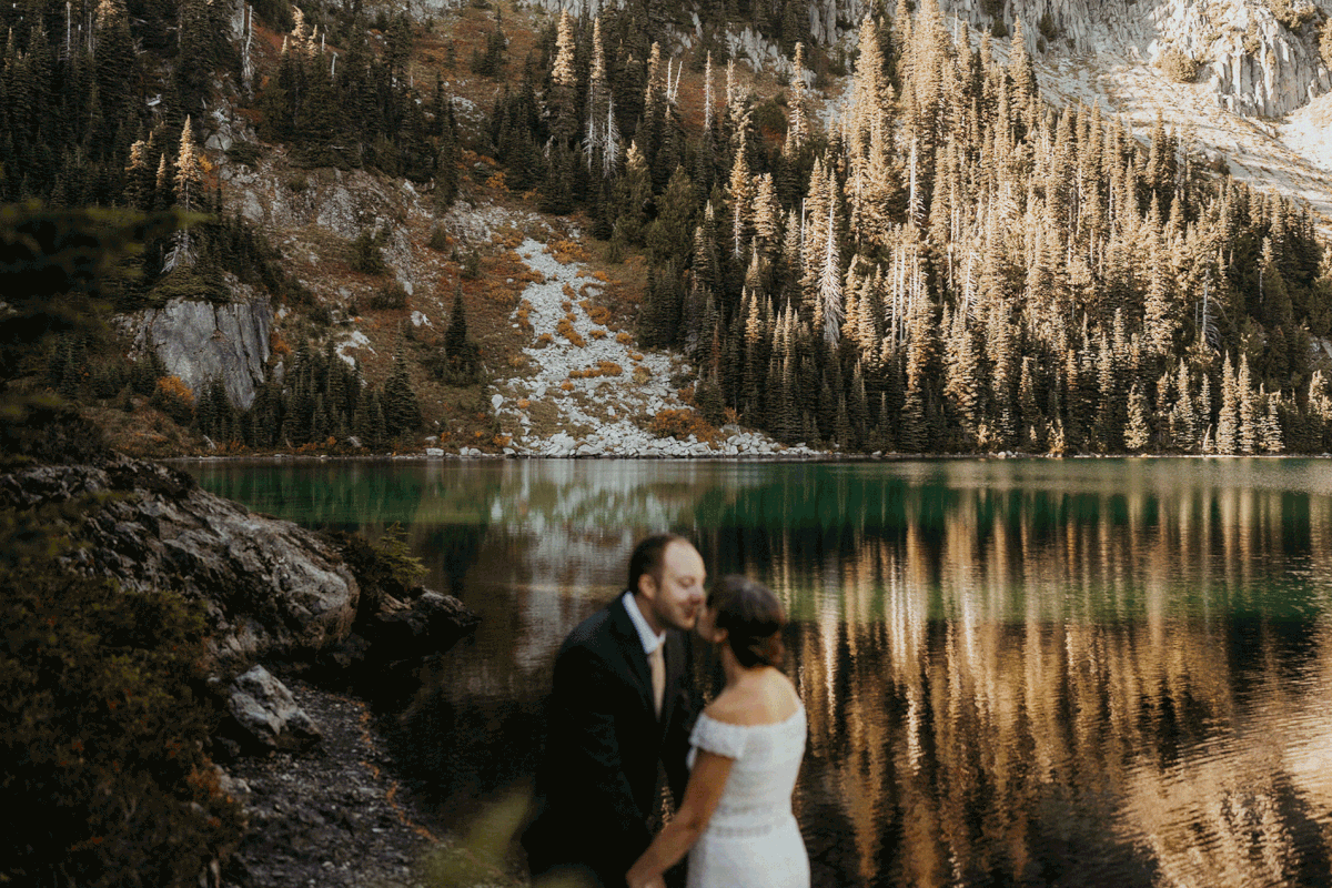 Bride and groom kiss after first look in Mt Rainier National Park