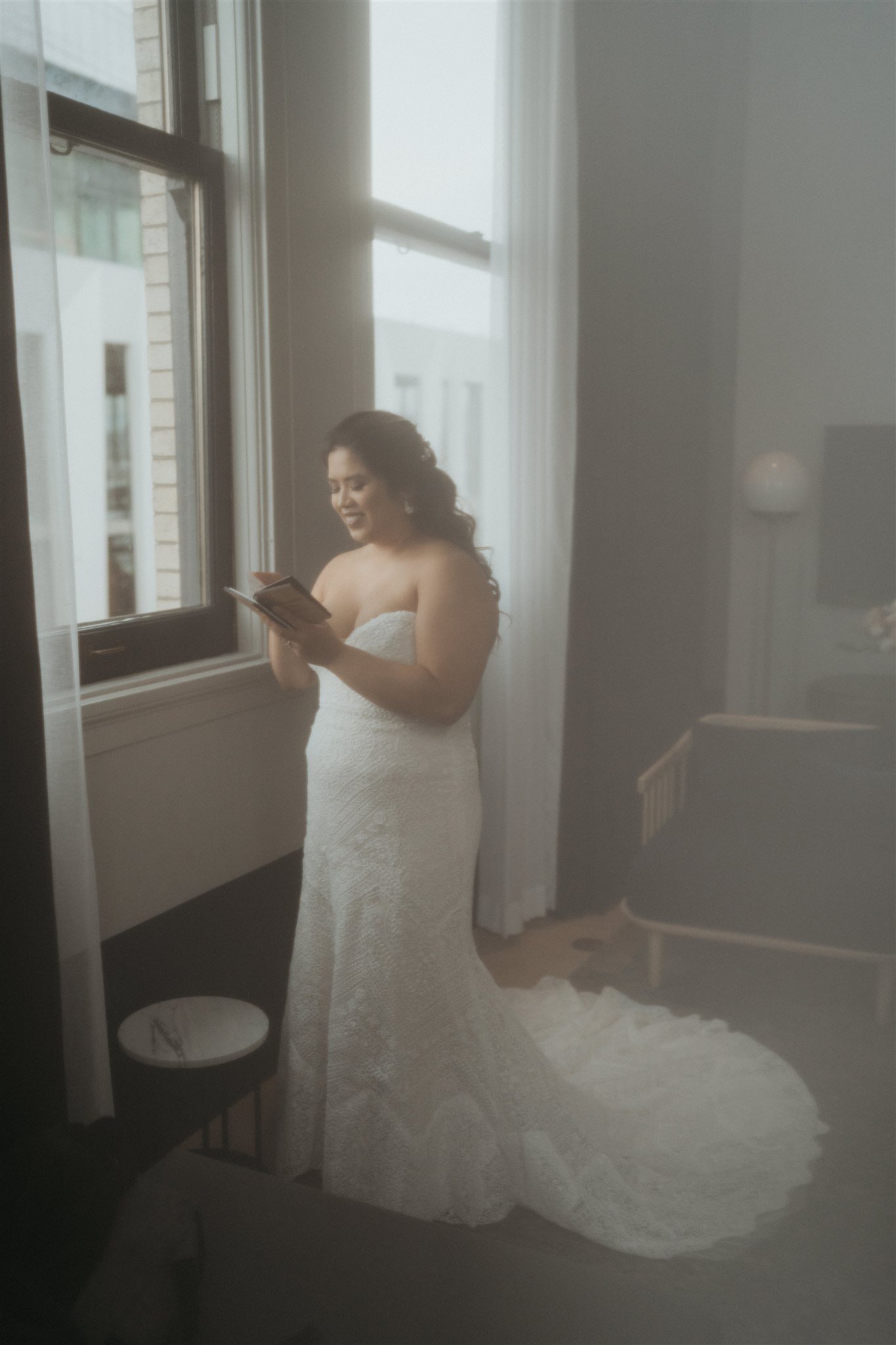 Bride reading vow book before Portland elopement