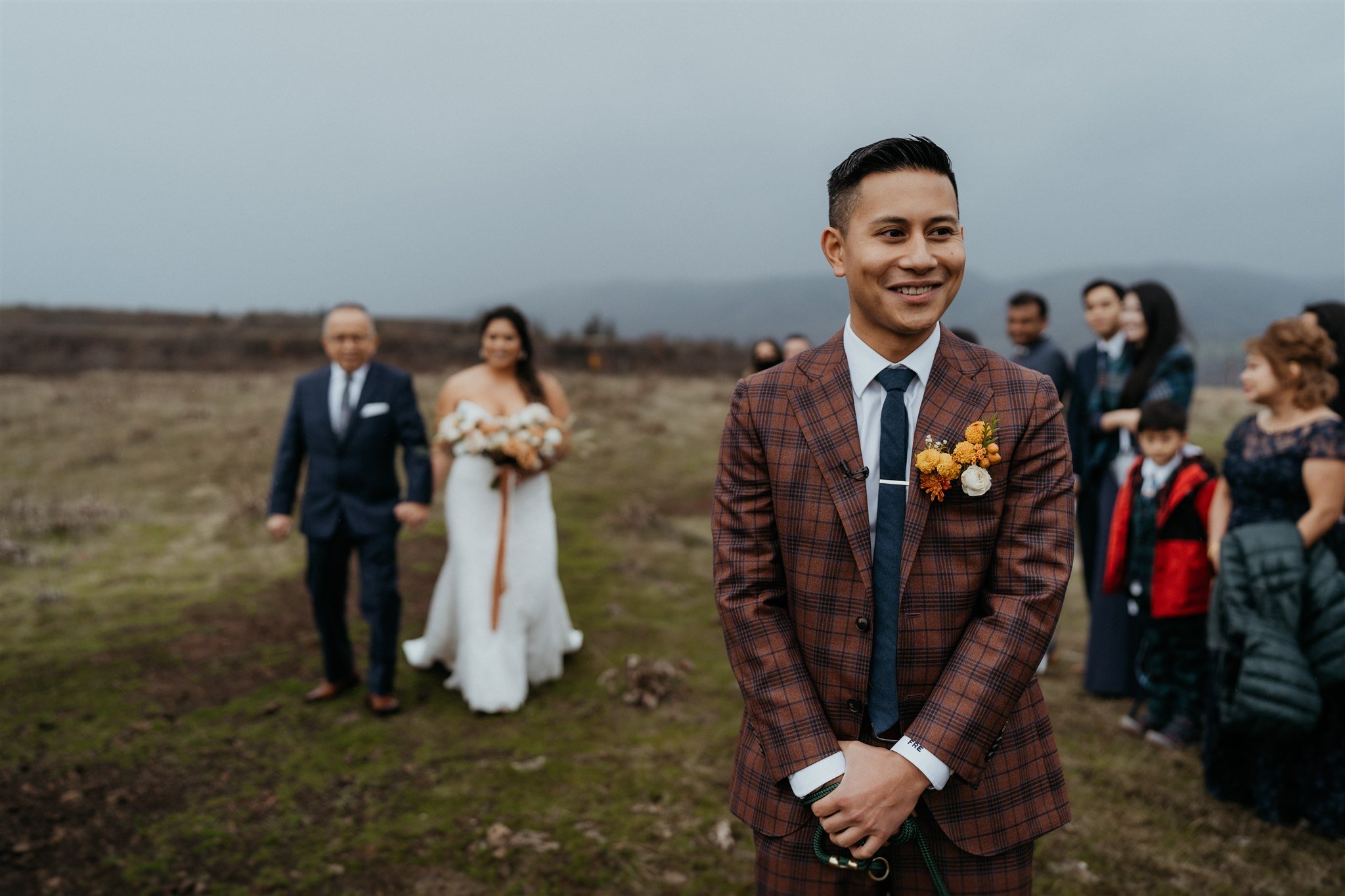 Bride walking up behind groom for first look at Oregon elopement