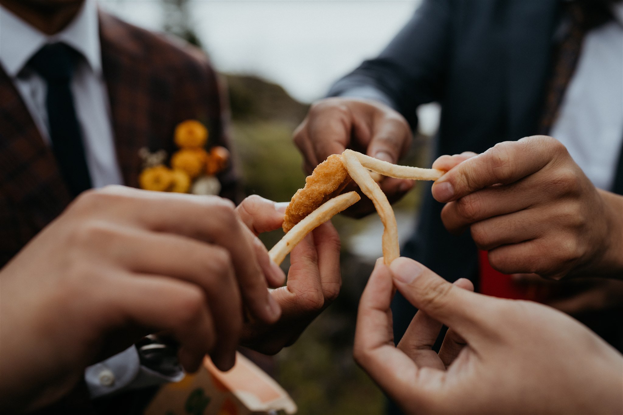 Bride and groom toast with french fries at Portland elopement