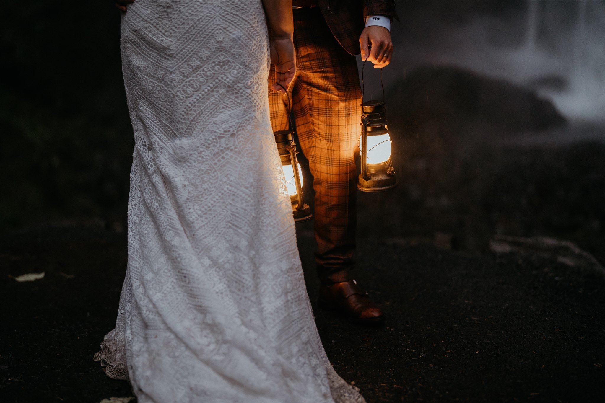 Bride and groom holding lanterns during Oregon elopement photos