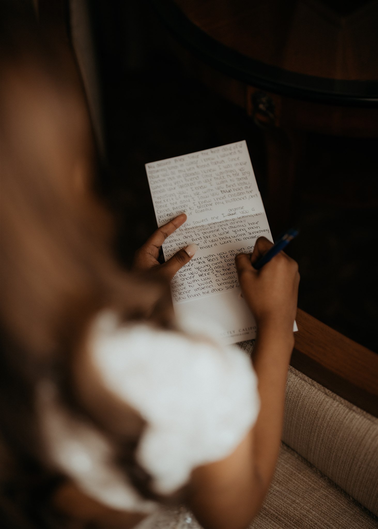 Bride writing a handwritten card before Big Sur elopement