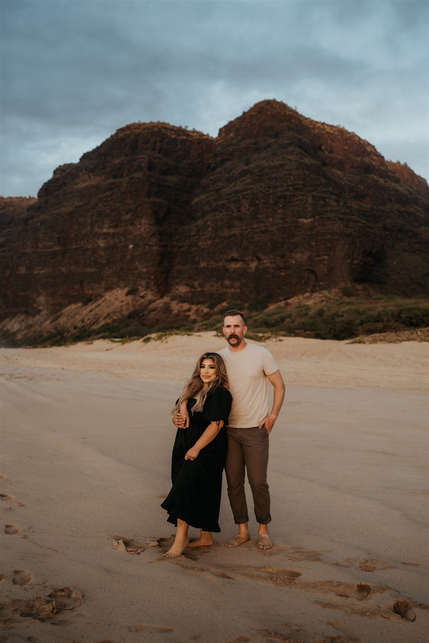 Couple portraits on the beach in Kauai after surprise proposal