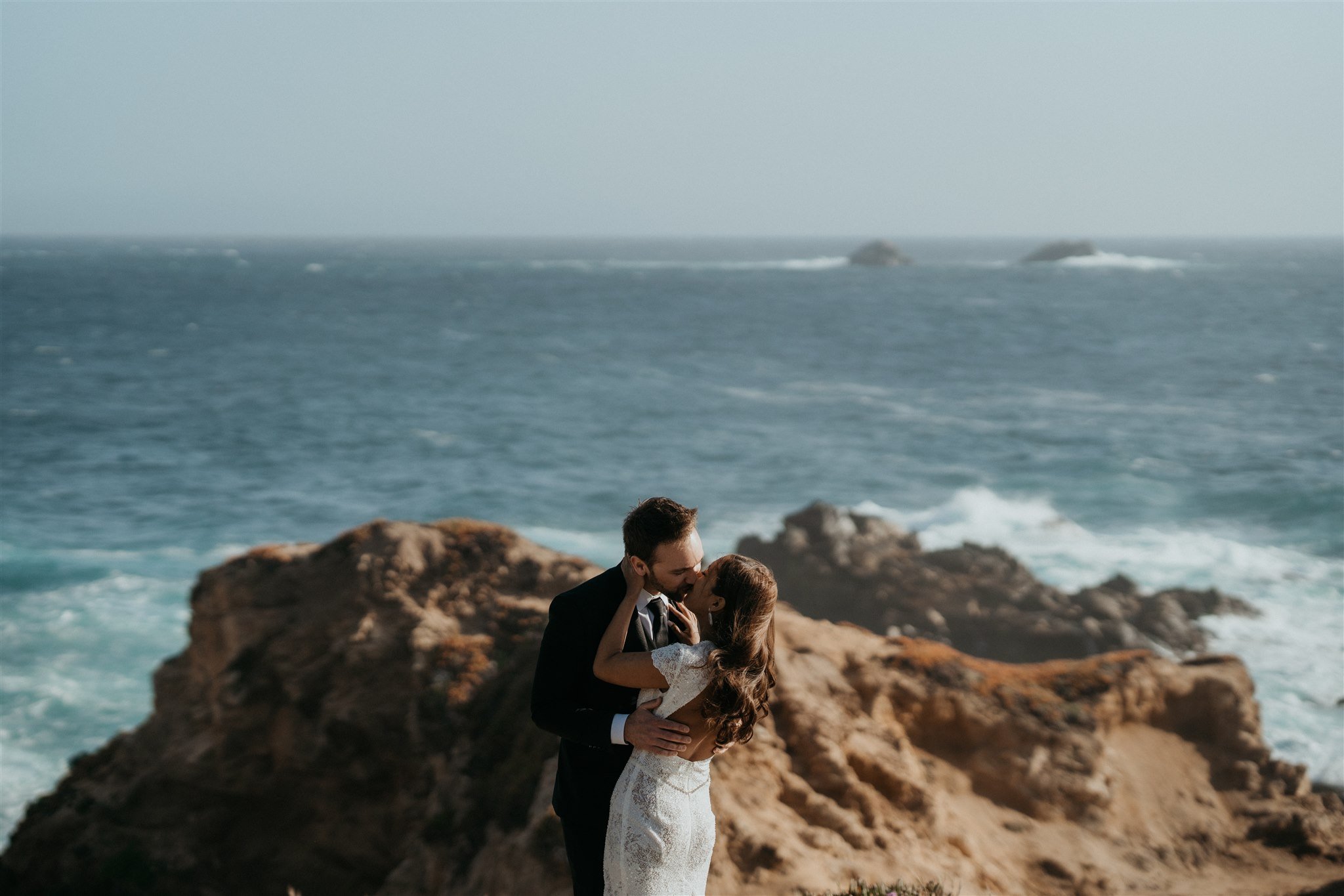 Bride and groom kiss during Big Sur elopement