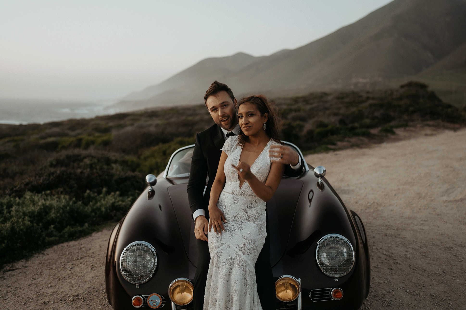 Bride and groom sunset portraits with vintage convertible at Big Sur elopement