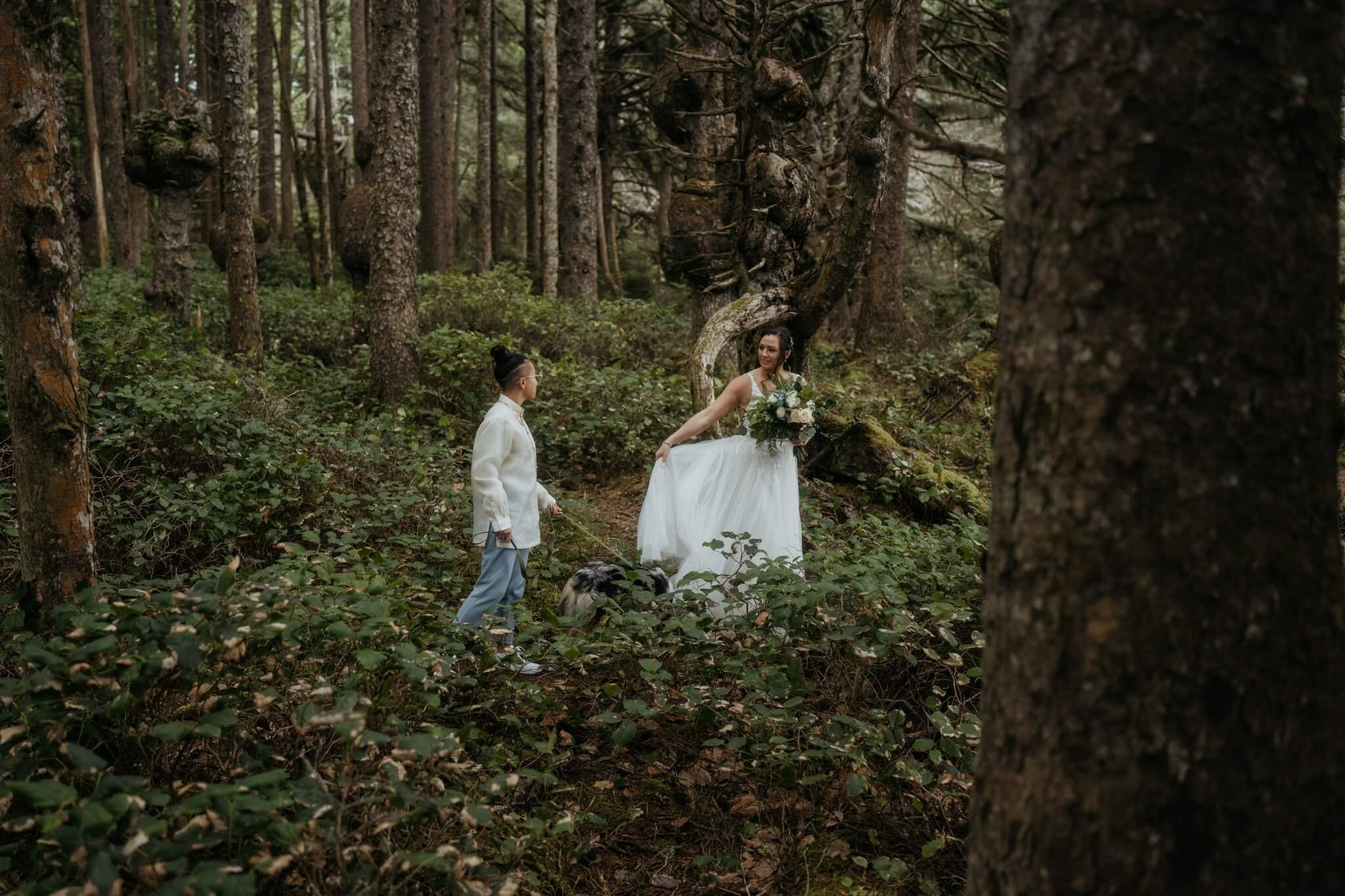 Two brides walking through the forest in Olympic National Park