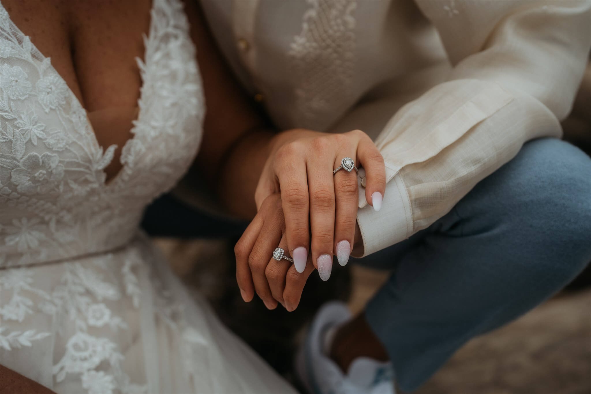 Two brides holding hands 